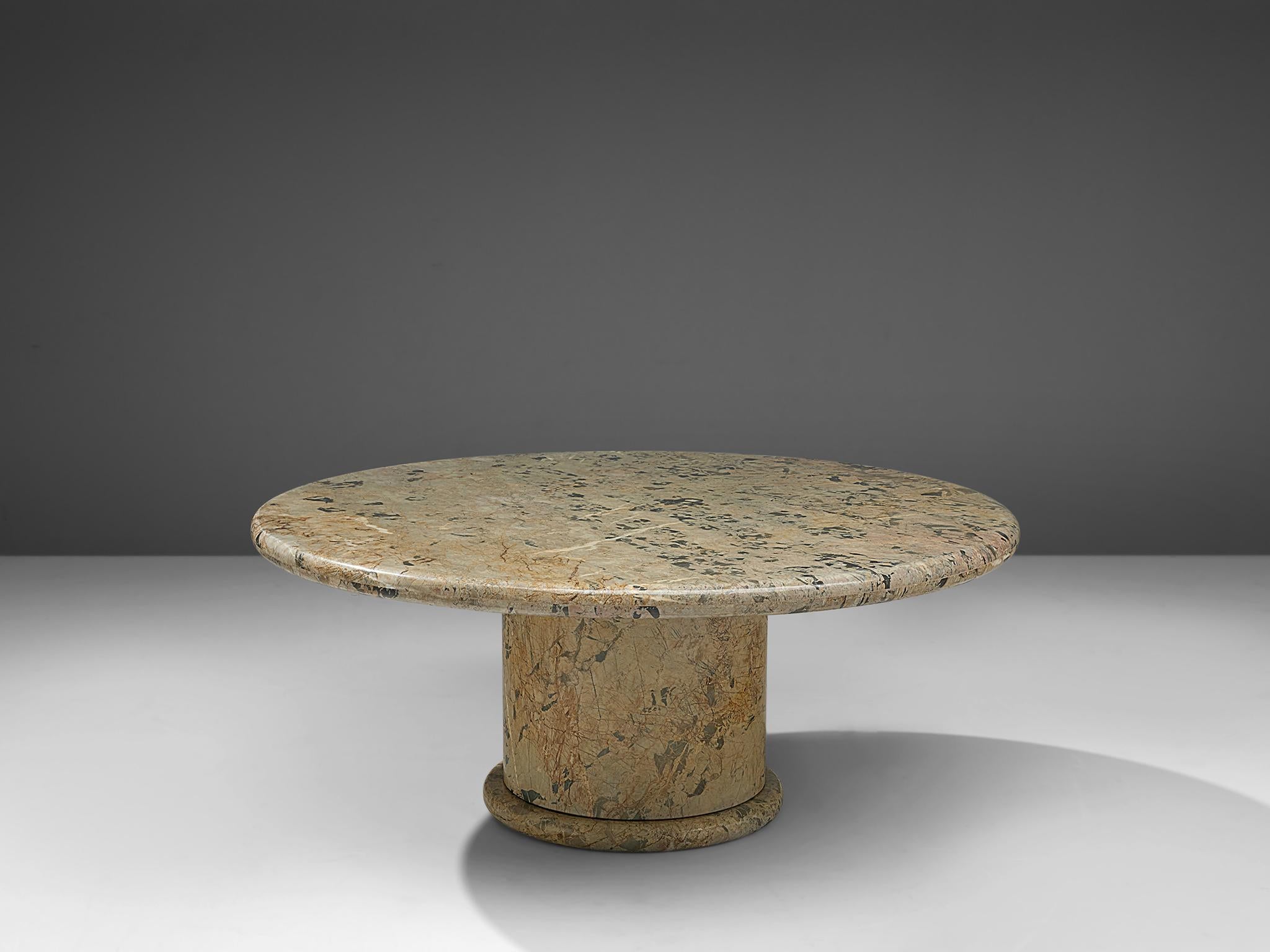 Round coffee table, colored marble, Italy, 1970s

This archetypical center table is a skillful example of Postmodern design. The table is executed in colorful marble. The round table features no joints or clamps and is architectural in its