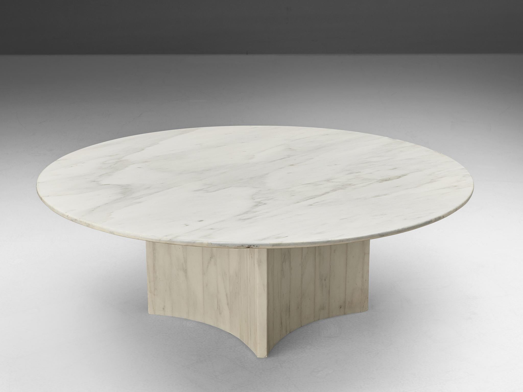 Coffee table, marble, Italy 1970s

This coffee table features a lovely cloud pattern in the marble. The aesthetics are archetypical for postmodern design, with a tasteful contrast between the round tabletop and the fourfold concave base. This