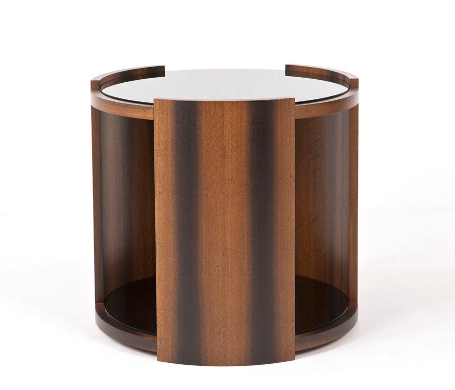 Modern round coffee table with a black glass internal shelf and black glass top.

The table photographed has been made with bog oak veneer to soften the sleek black glass top and shelf. It has a diameter of 600mm and us 650mm in height.

These