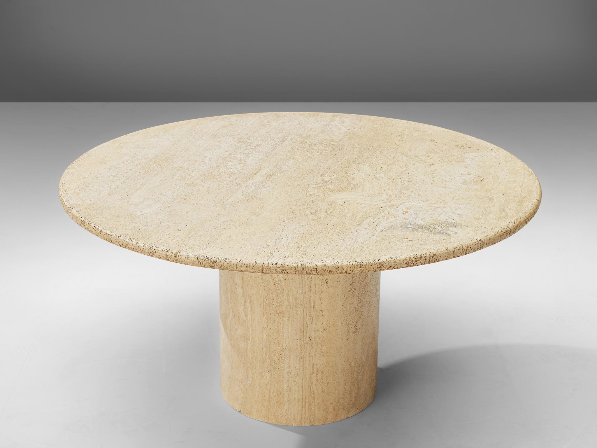 Cocktail table, travertine, Italy, 1970s.

This strong coffee table features a column foot and a thick circular tabletop. The aesthetics are archetypical for postmodern design, bearing references to architectural forms and without a clean