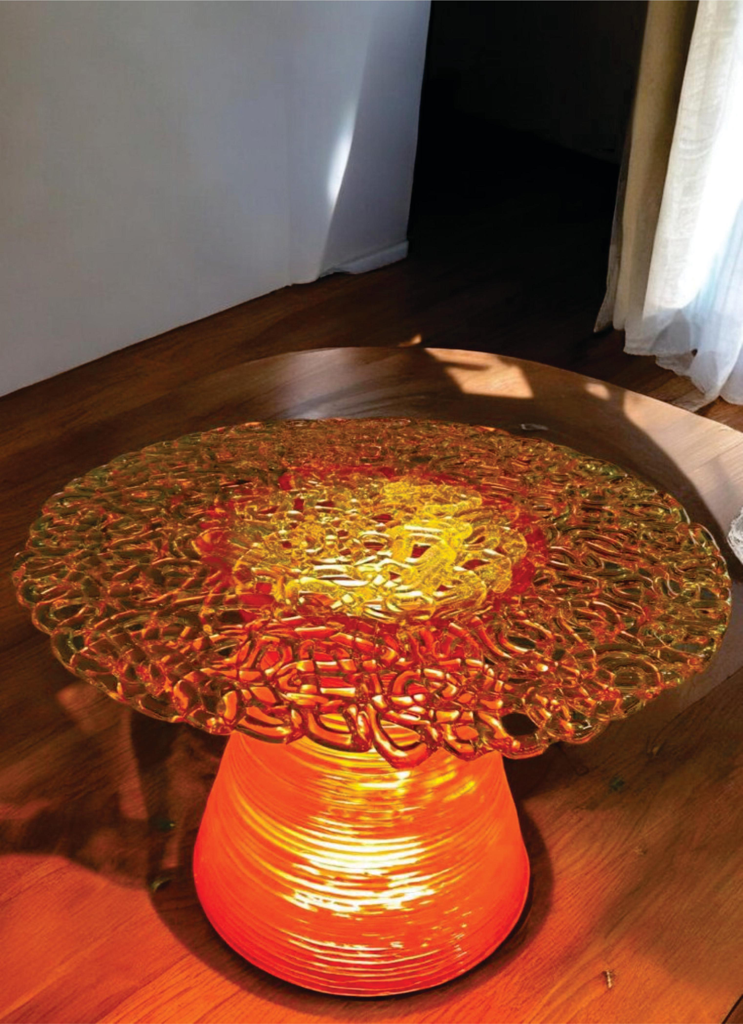 Elevate your living space with the Round Coffee Table, where elegance meets craftsmanship. The meticulously stitched table top sits gracefully atop a luminous pedestal, commanding attention and transforming your entire room. The delicate interplay