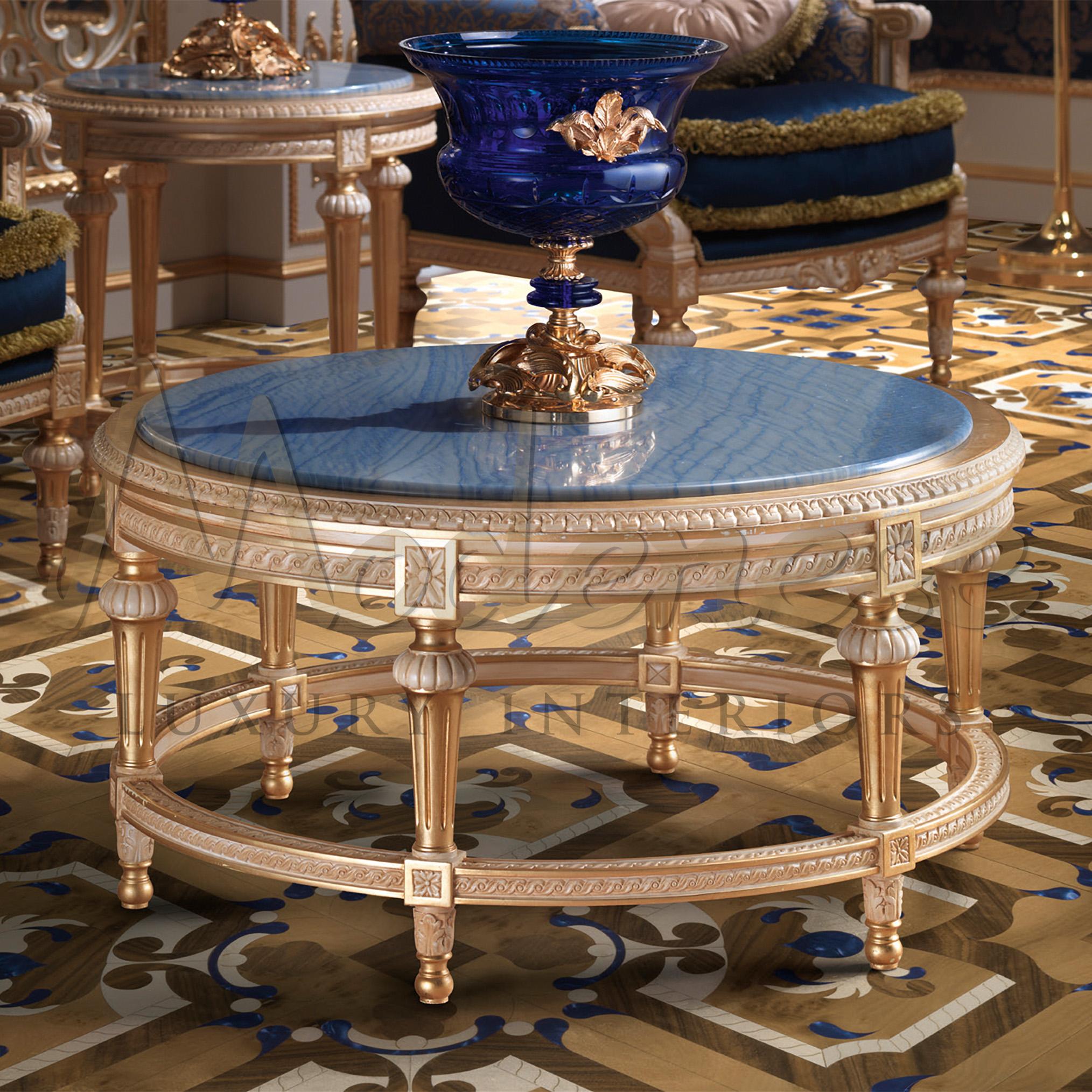 Modenese artisans kwoledge of gold leaf applications goes beyond imagination. The true essence of their work is shown through this magnificent round coffee table, that catches the eye with its tasteful combination of Azul Macaubas marble and shining