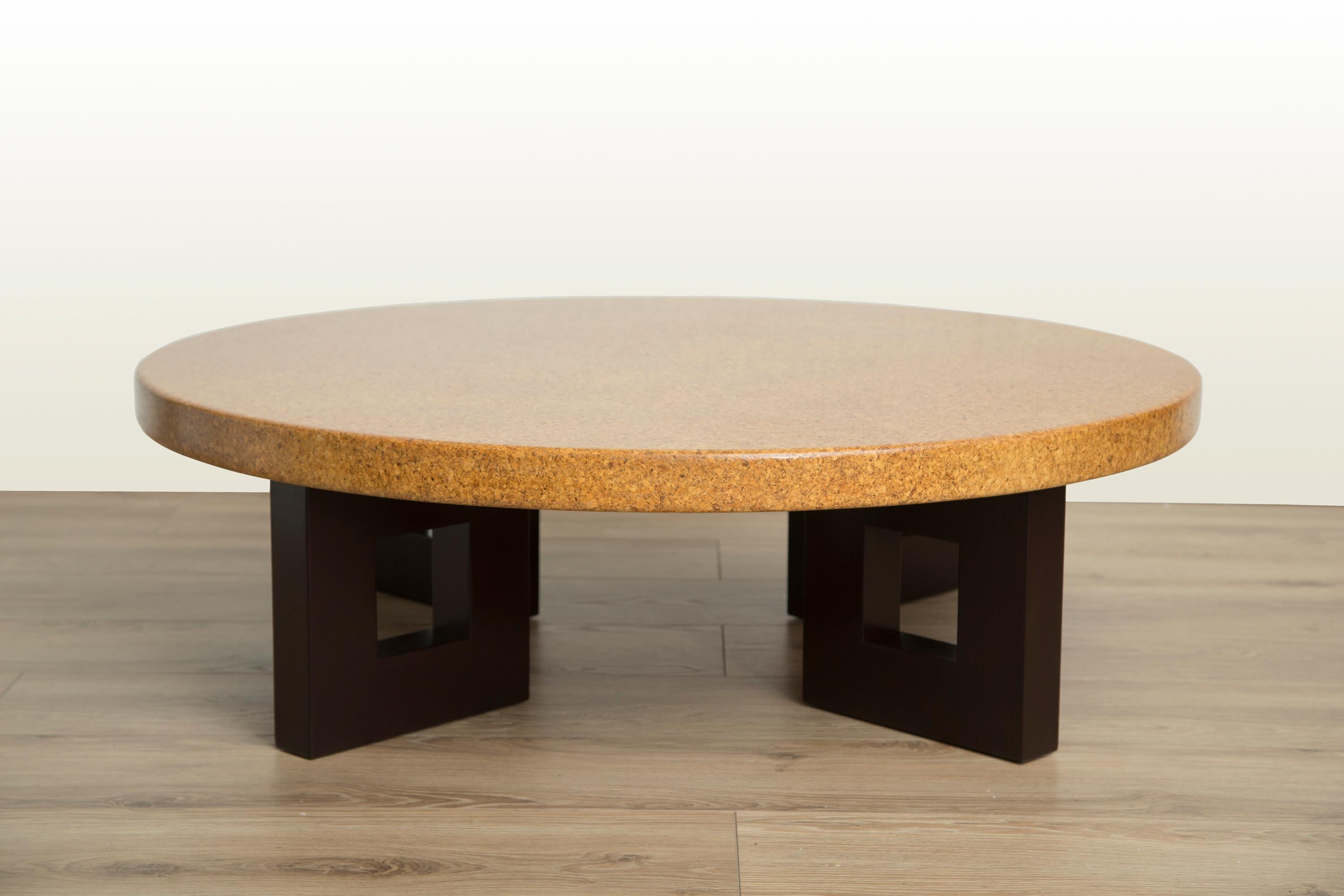 Mid-Century Modern round cork top coffee table with stained mahogany frame-shaped legs by Paul Frankl for Johnson Furniture.
Model #5021, circa 1950.
Newly refinished to mint condition.
 