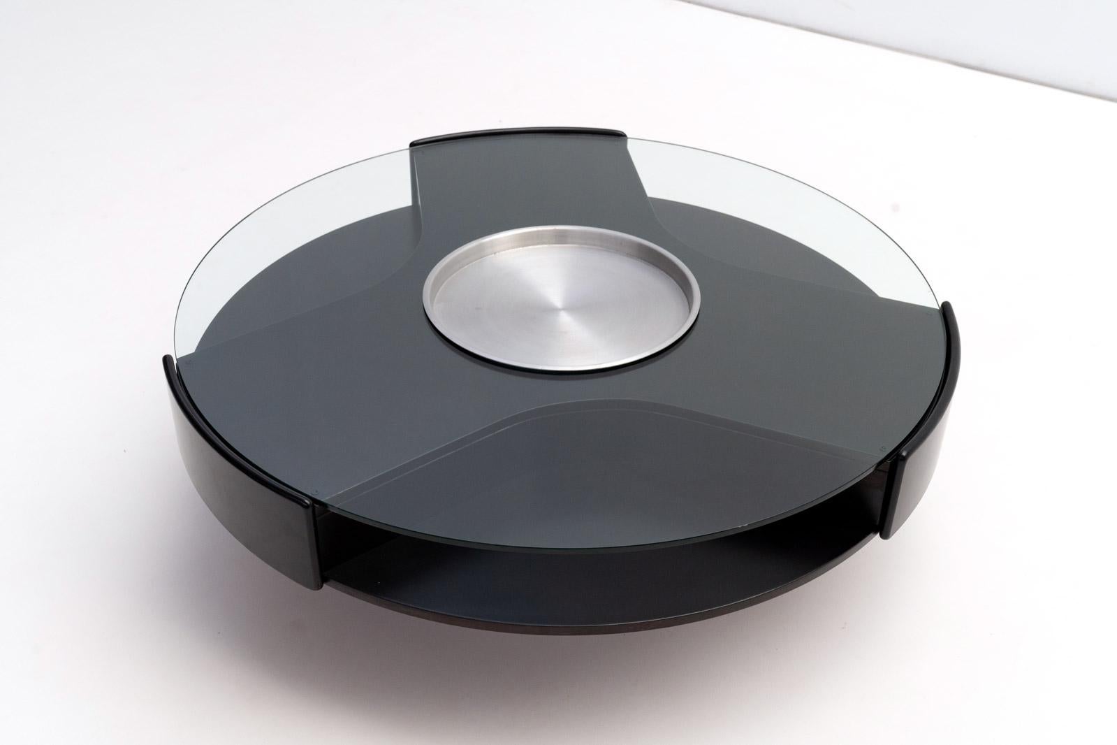 Upgrade your living space with this versatile round coffee table. Designed with aluminum round feet, it combines modern aesthetics with practical features.

Features:

Thick Glass Top: Provides a sturdy and stylish surface.
Three Drawers: Convenient