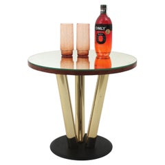 Runder Couchtisch mit Spiegelplatte und Messing- und schwarzem Metallfuß