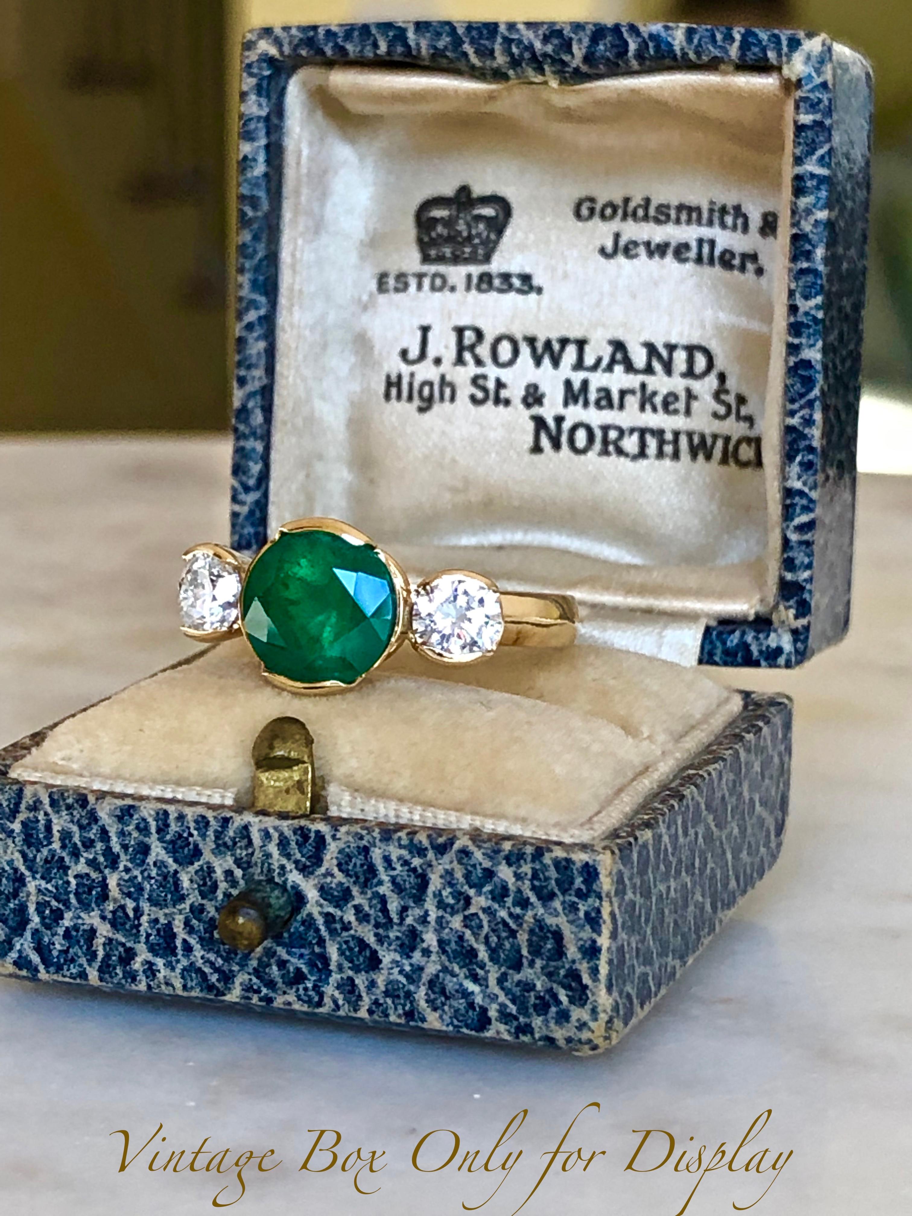Beautiful Estate Engagement Three Stone Ring Centering a Fine Natural Colombian Round Cut Emerald 8.50mm of Diameter Weighting 2.85 Carats 
Color/Clarity Emerald: AAA+ Color Intense Green/VS-SI
Accent Stones: Genuine Diamond
Shape or Cut Diamond: 2