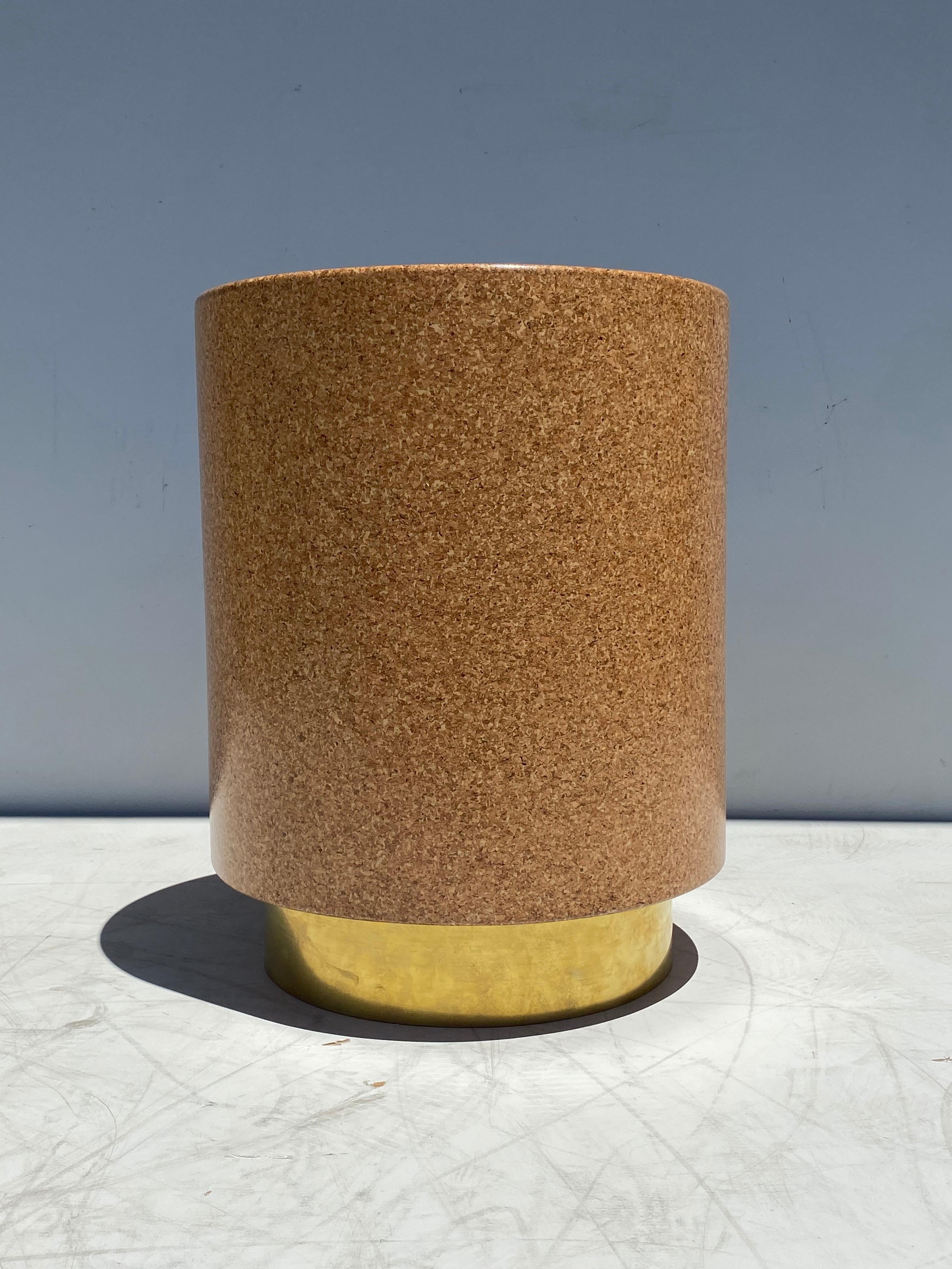 Round cork and brass side table or stool. Brass base is not lacquered and will get patinated over time. Newly made inspired by midcentury furniture designers like Paul Frankl, Charlotte Perriand, Robsjohn Gibbings, Milo Baughman and Harvey Probber.