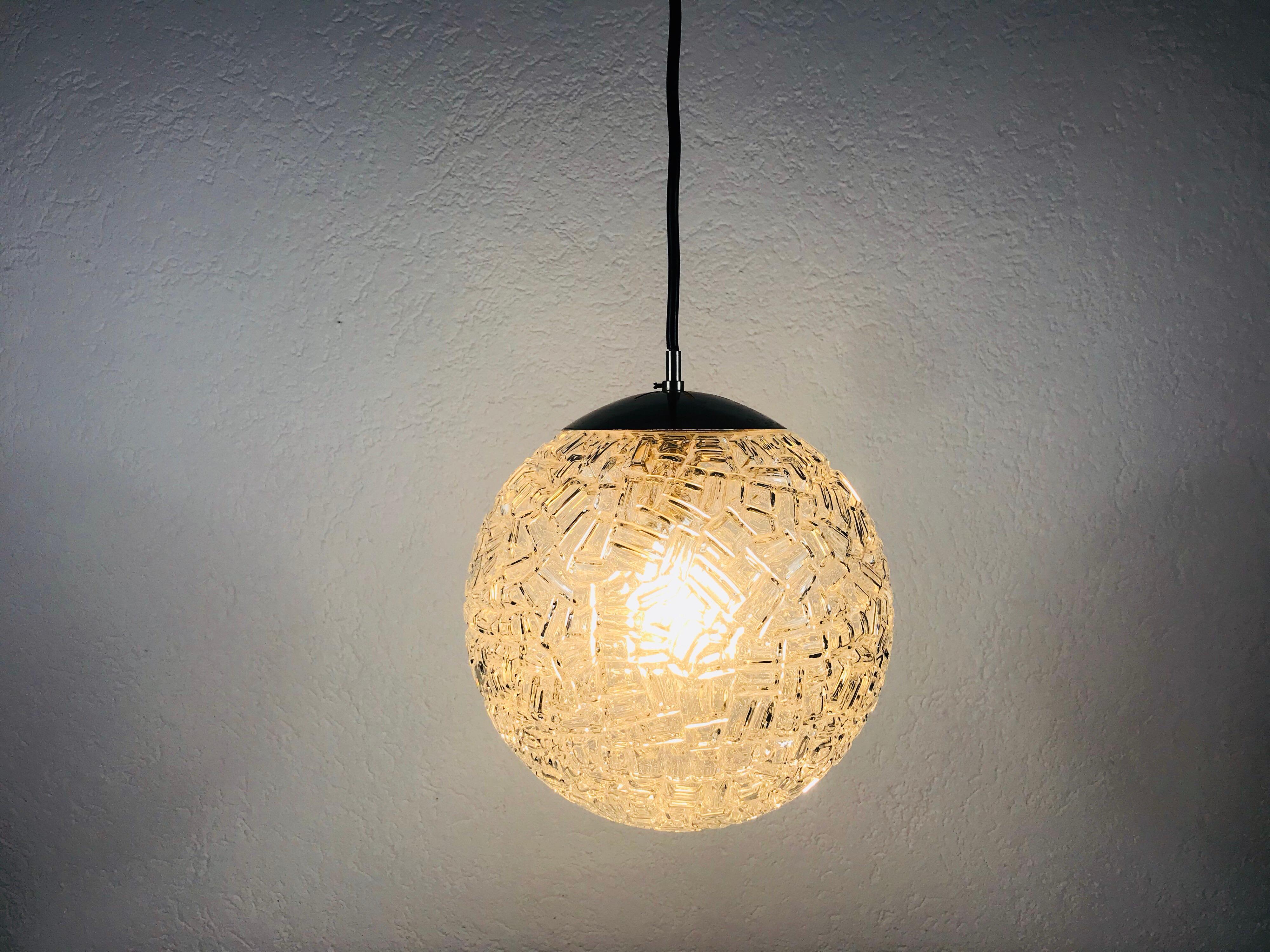 A beautiful glass bowl hanging lamp made in Germany in the 1970s. The light is made of Murano glass.

Measurements:

Height: 60 cm

Diameter: 20 cm

The light requires one E27 light bulb..