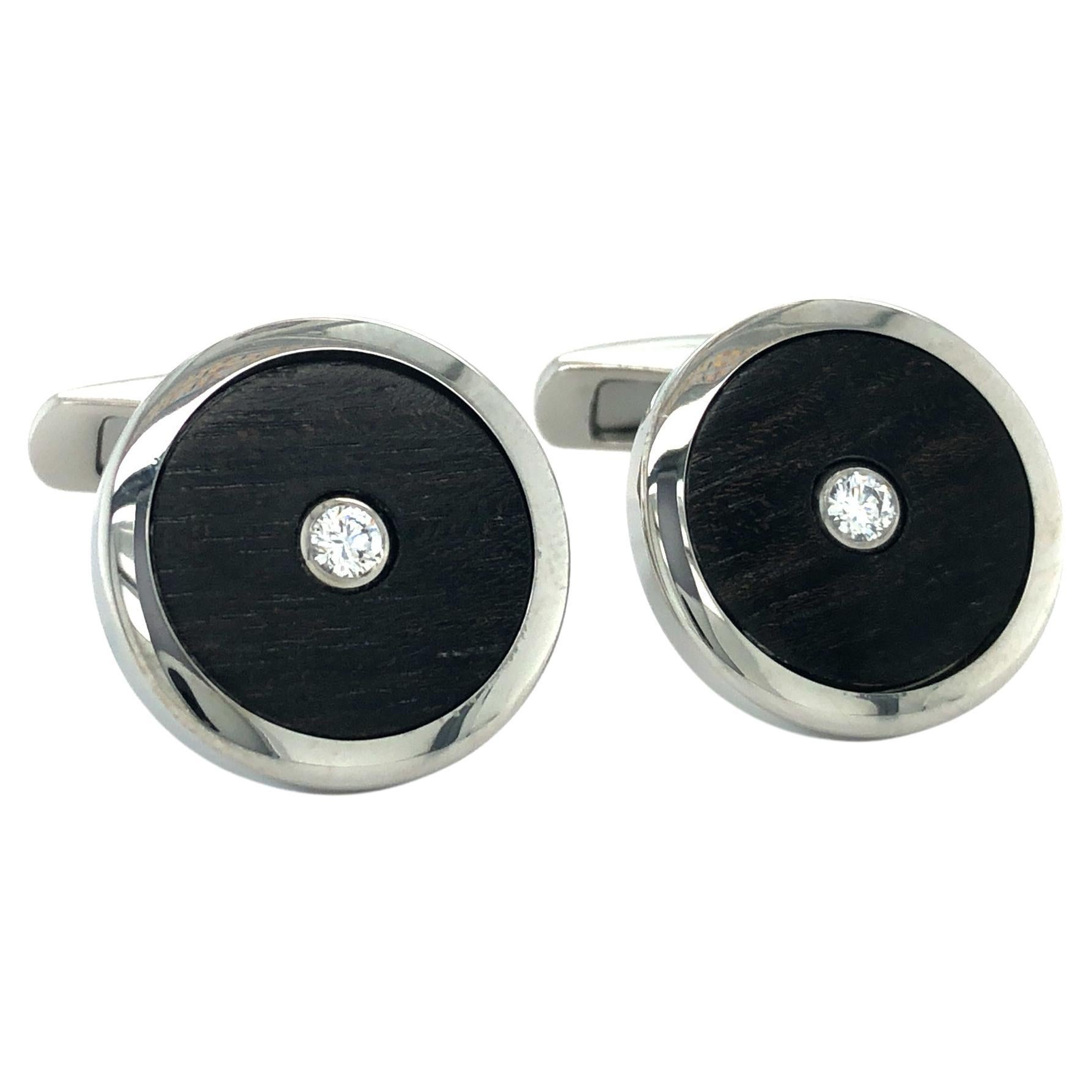 Victor Mayer round stainless steel cufflinks, Hallmark Collection, precious wood inlays, 2 brilliant-cut diamonds total 0.2 ct, H VS, diameter 19 mm 

From VICTOR MAYER's Hallmark Collection, these stainless steel cufflinks epitomize timeless