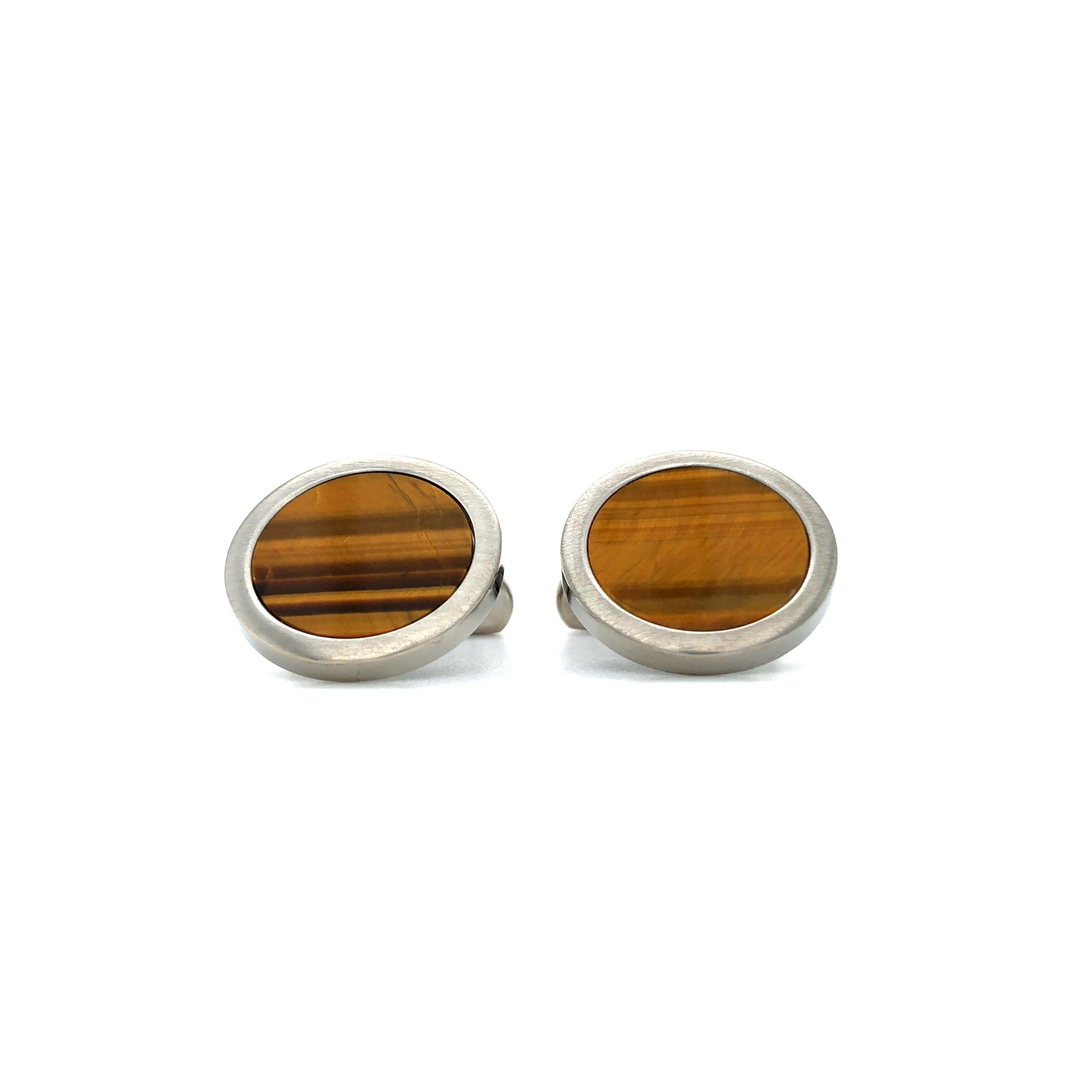 Round Cufflinks, Hallmark Collection by Victor Mayer, Stainless Steel, Tiger Eye Gemstone Inlay, Diameter 19 mm

About the creator Victor Mayer
Victor Mayer is internationally renowned for elegant timeless designs and unrivalled expertise in