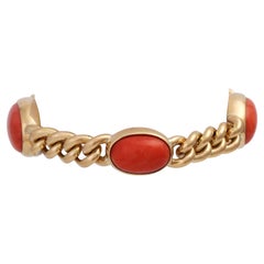 Used Round curb bracelet, especially with 4 coral cabochons in a fine color.