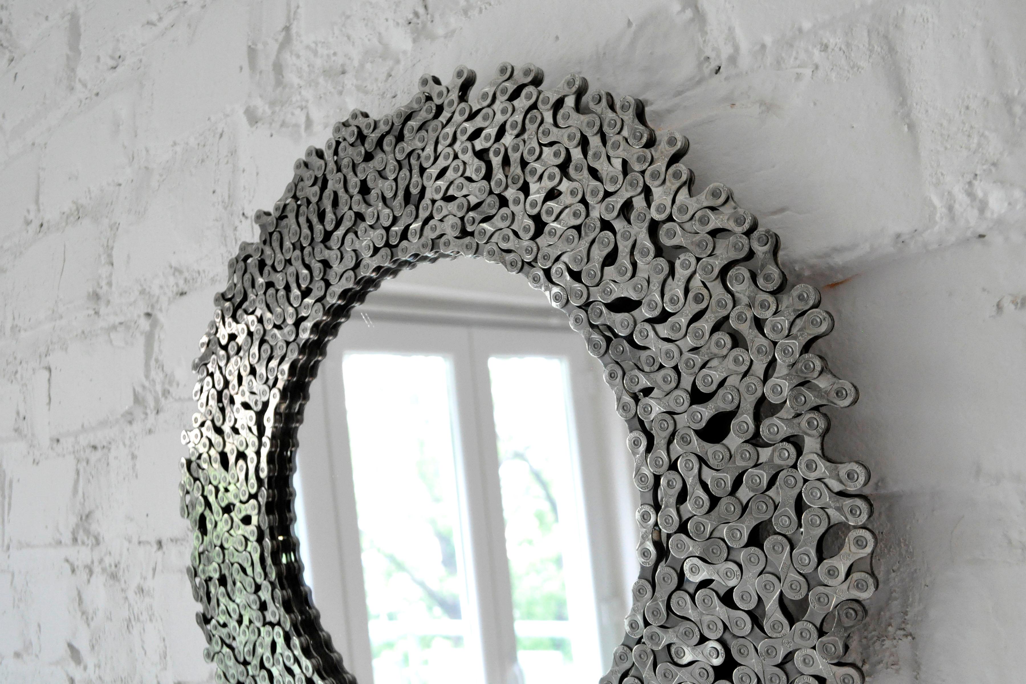 Mirror frame made from luxury silver shine bicycle chains with beautifully shaped links, rivets with a hole and nice X8 stamping.
Original and decorative upcycled piece, you can hang on the wall are use as a standing toilet mirror.

 