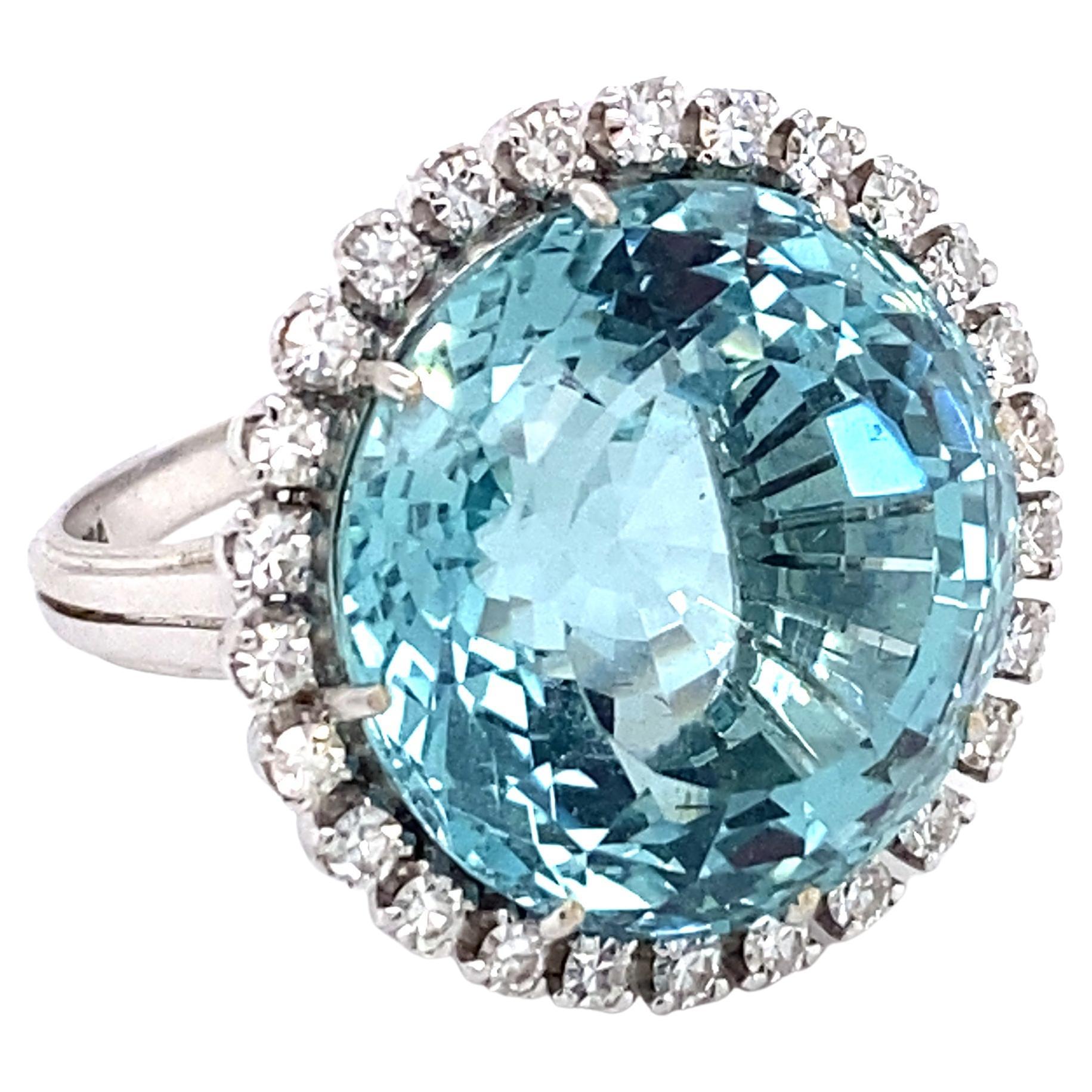 Round Custom Cut Aquamarine and Diamond Halo Ring in Platinum and 14K White Gold