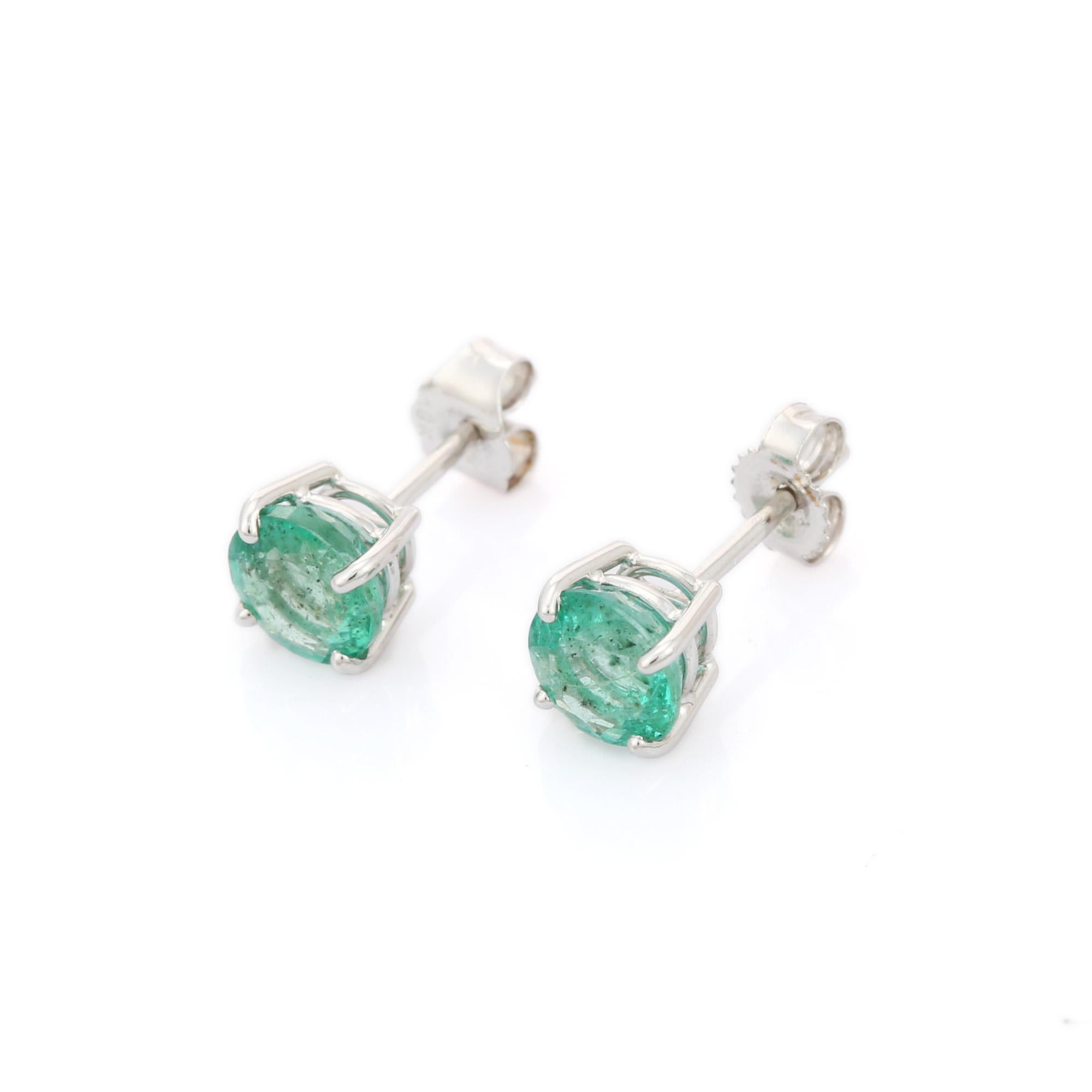 Earrings create a subtle beauty while showcasing the colors of the natural precious gemstones  making a statement.

Round cut Emerald Stud earrings in 18K gold. Embrace your look with these stunning pair of earrings suitable for any occasion to