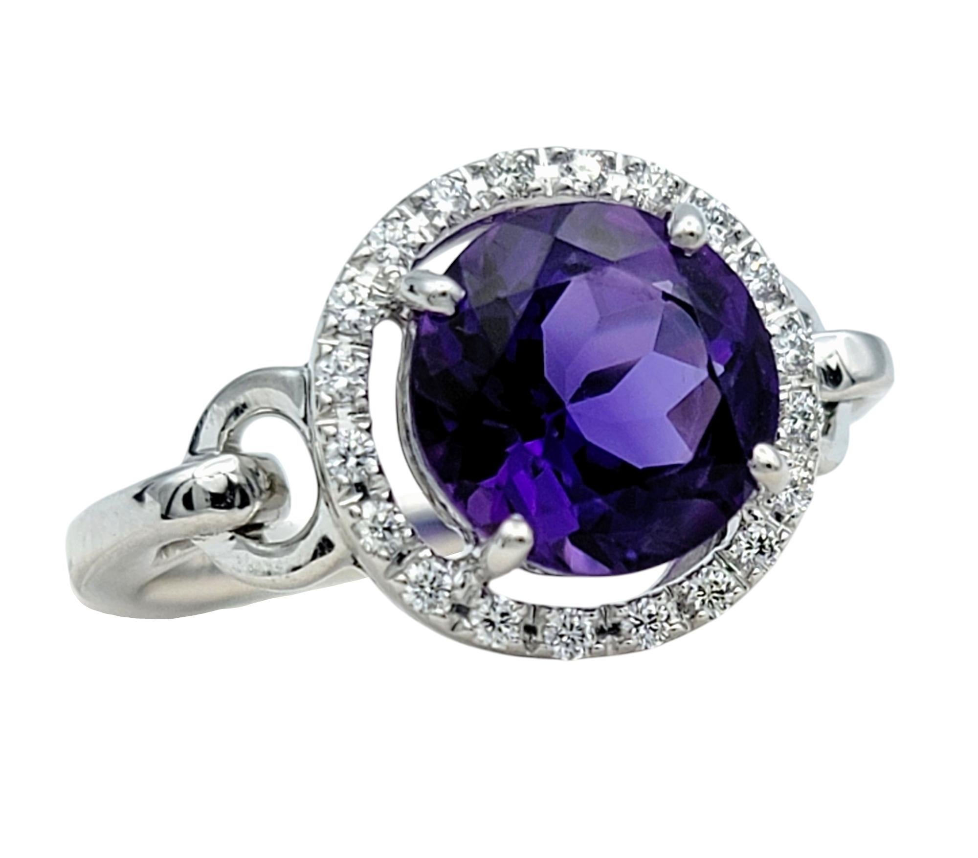 Ring Size: 7

Discover timeless elegance with this captivating amethyst and diamond ring. At its center lies a dazzling round-cut amethyst, boasting a vivid purple hue that exudes sophistication and charm. The expertly faceted gemstone catches the