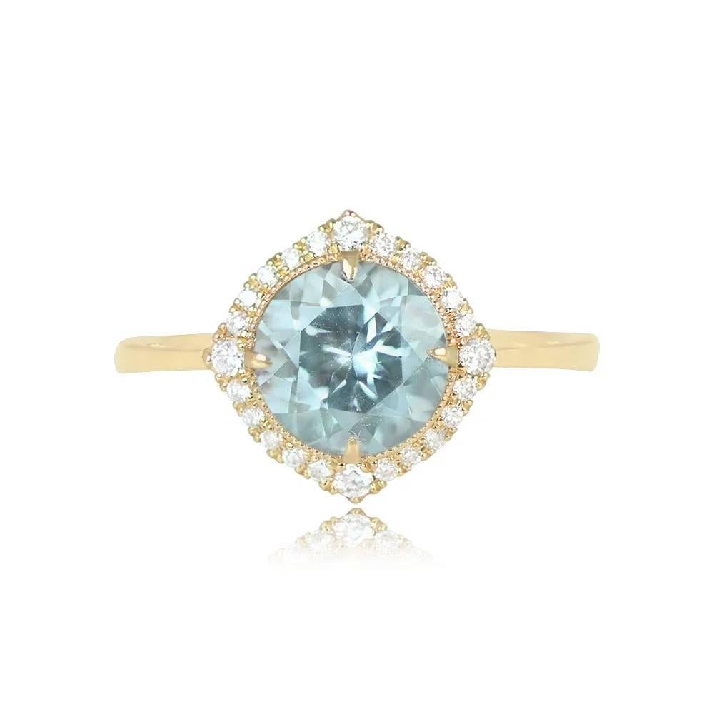 An aquamarine engagement ring with a round-cut center stone set in prongs, accented by a halo of round brilliant-cut diamonds totaling approximately 0.23 carats. Handcrafted in 18k yellow gold.

Ring Size: 7 US, Resizable
Metal: Gold, Yellow