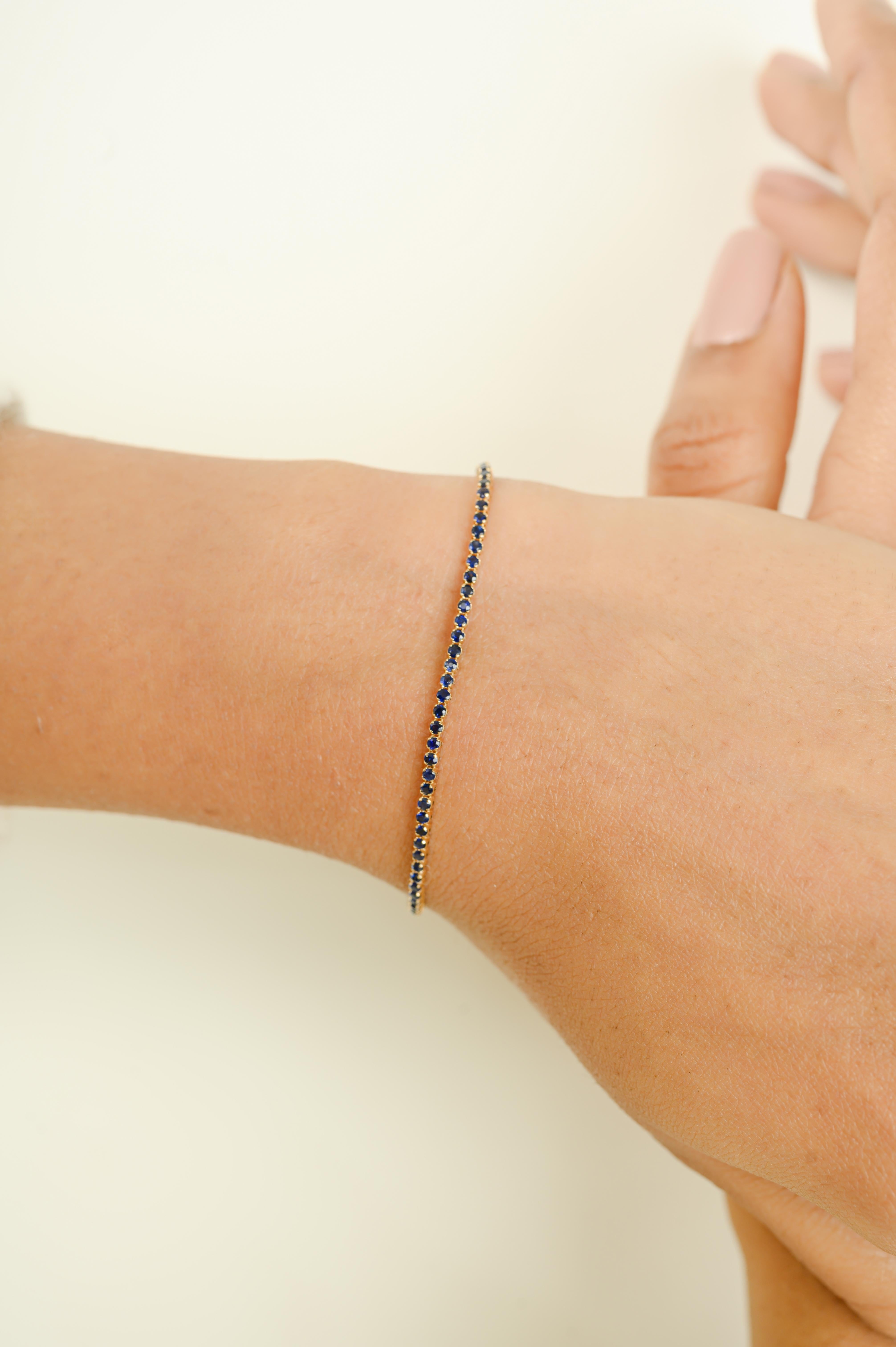 This Round Cut Blue Sapphire Sleek Bracelet in 14K Yellow Gold for Valentine Gifts showcases endlessly sparkling natural blue sapphires, weighing 1.65 carat. It measures 6.5 inches long in length. 
Sapphire stimulate concentration and reduces