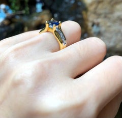 Round Cut Blue Sapphire with Diamond Ring Set in 18 Karat Gold Settings
