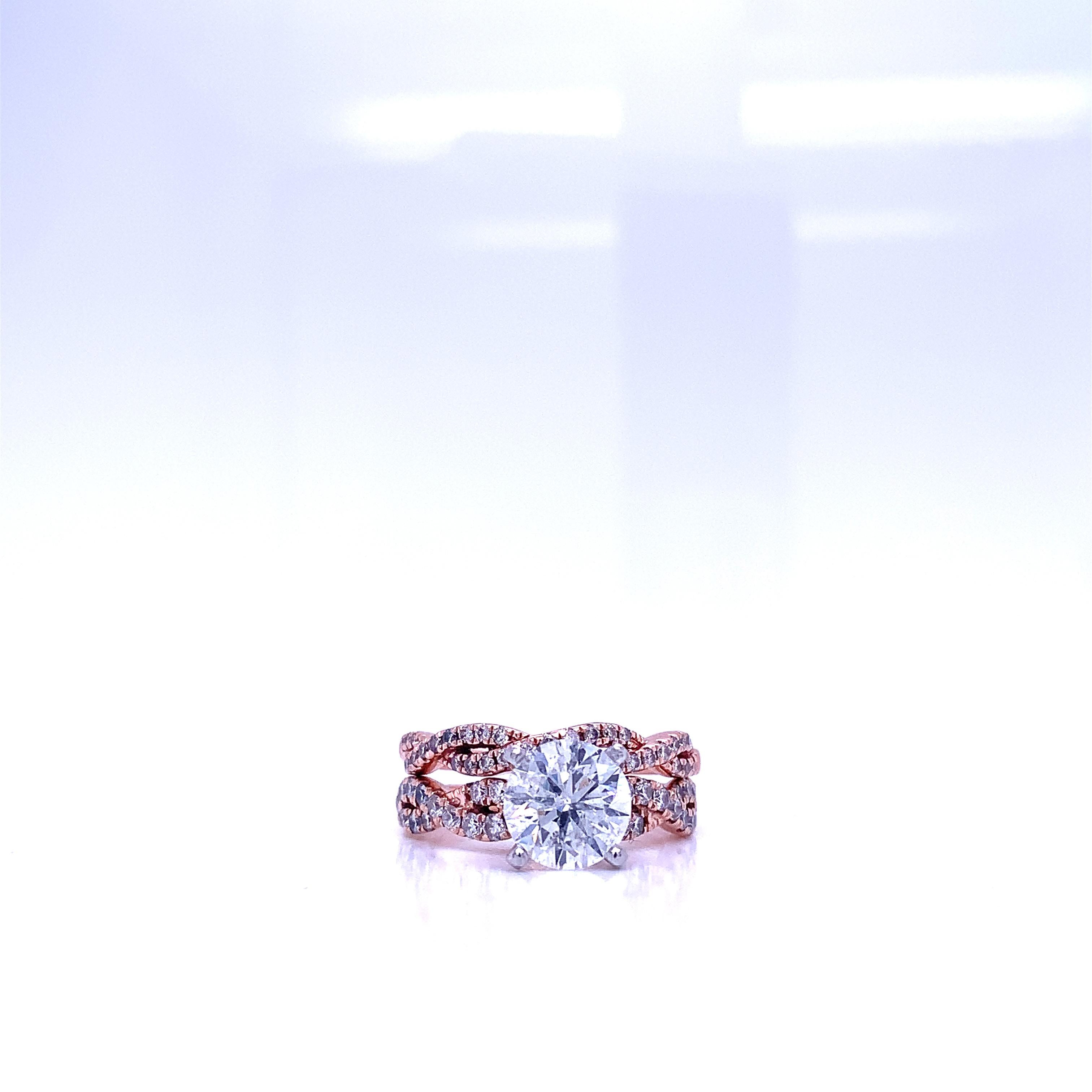 A beautiful round brilliant cut diamond single engagement ring set in 14K Rose Gold.  The ring is solely set with a beautiful 2.08 carat diamond and 0.65 carat diamonds on the band in H Color, I1 Clarity. The beauty of this piece all lies in the