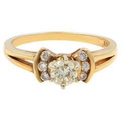 Anillo de compromiso de oro amarillo de 14 quilates con diamantes talla redonda 0,45 qtw