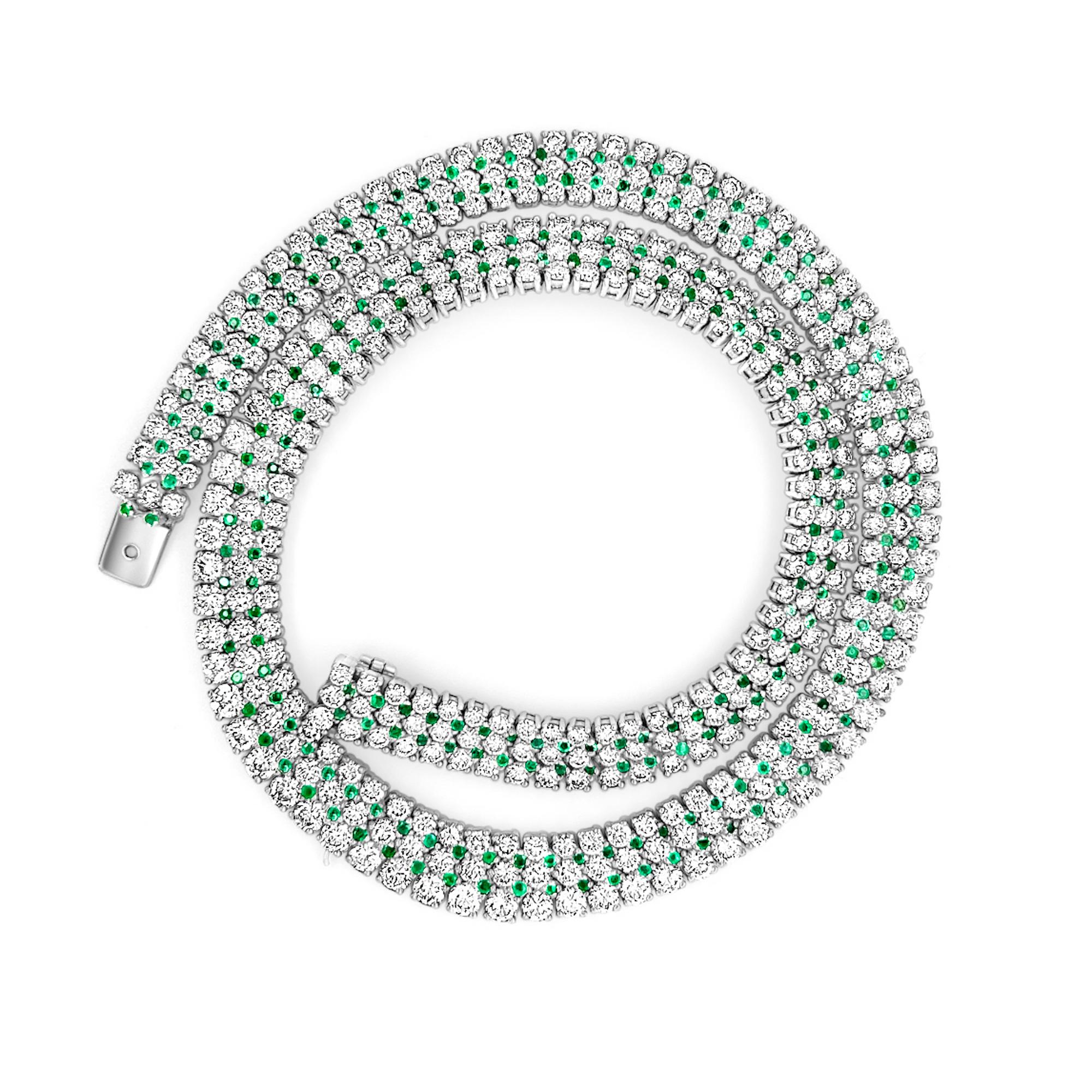 Presenting this magnificent 27-carat diamond and emerald pave choker. Set in 18 karat white gold. This hand-made luxury choker features flexible and sturdy tri-links connecting each diamond. The 3 interlocked strands allow for a flexible fit, while