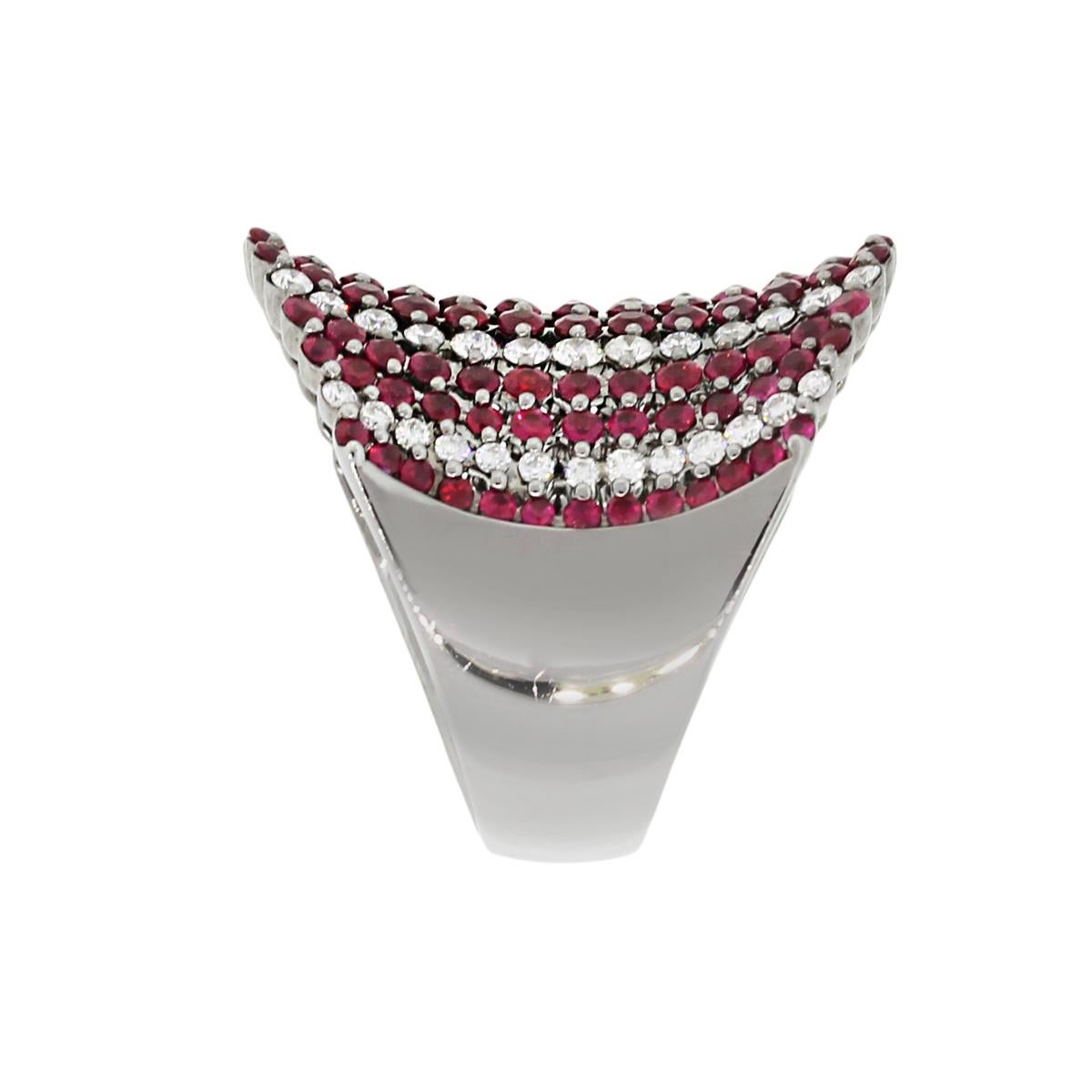 Material: 18k White Gold
Diamond Details: Approximately 1.6ctw of Round cut diamonds. Diamonds are G/H in color and SI in clarity.
Gemstone Details: Approximately 1.32ctw of round cut rubies.
Ring Size: 7.25
Ring Measurements: 0.80″ x 1″ x 1″
Total