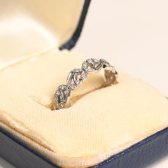 Round Cut Diamond (Approx. 0.20-Carats) Floral-Motif Eternity Band, Platinum