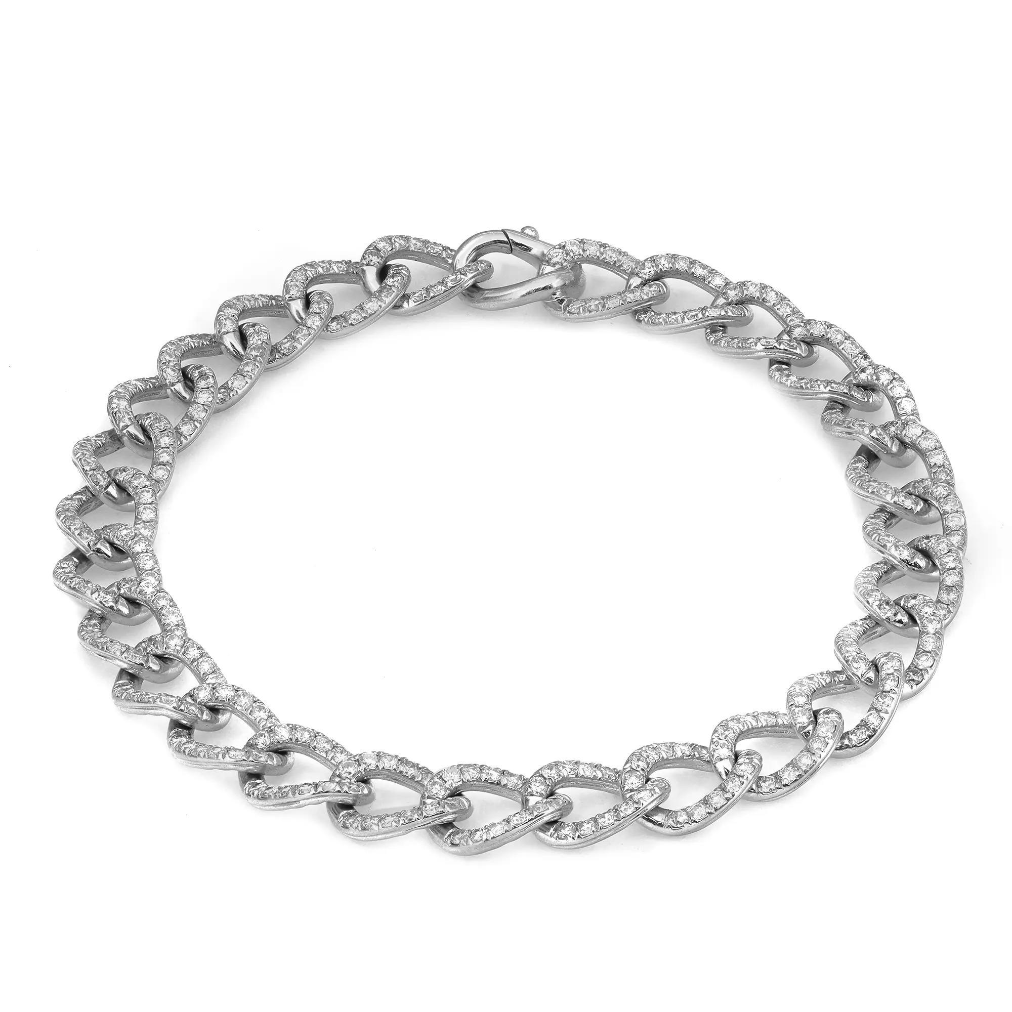 Adorn a beautiful blend of style and simplicity with this Cuban link chain bracelet. Featuring, pave set round brilliant cut diamonds studded in a Cuban link chain bracelet. Total diamond weight: 2.69 carats. Diamond Quality: G-H color and SI