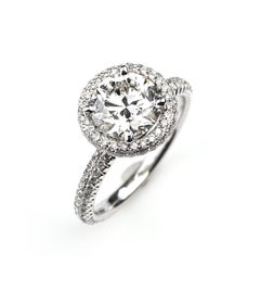 Round Cut Diamond Engagement Ring with Pavé Halo and Shank in White Gold