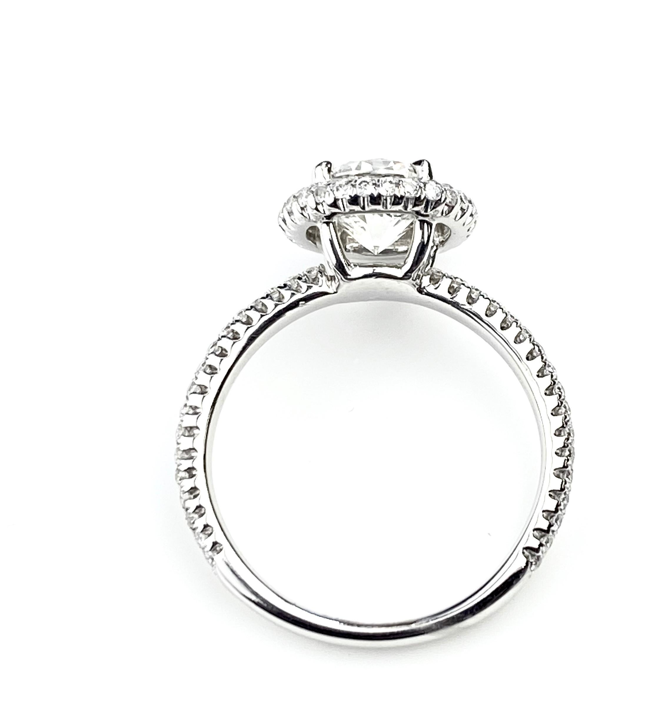 Round Cut Diamond Engagement Ring with Pavé Halo and Shank in White Gold In New Condition For Sale In Toronto, Ontario