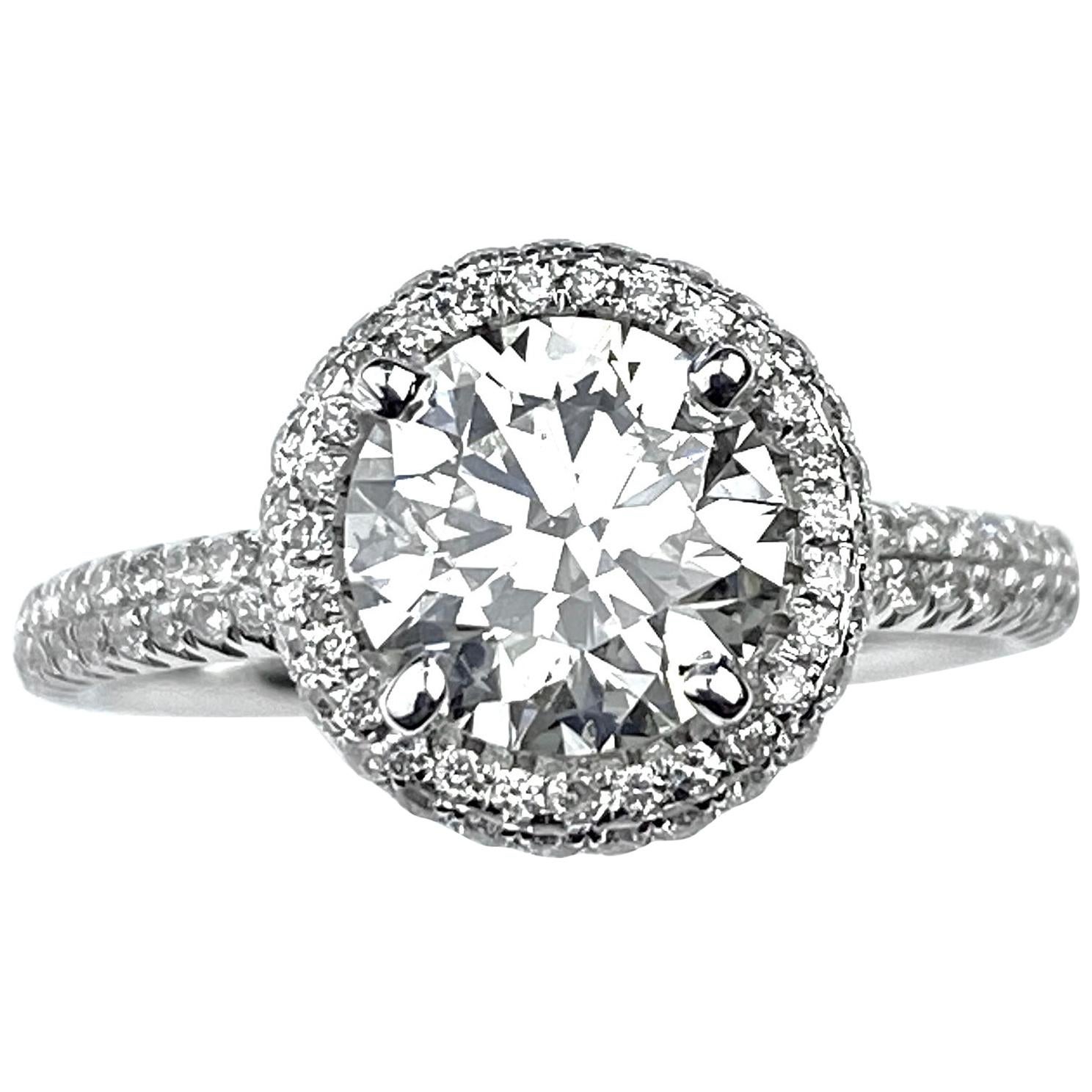 Round Cut Diamond Engagement Ring with Pavé Halo and Shank in White Gold For Sale