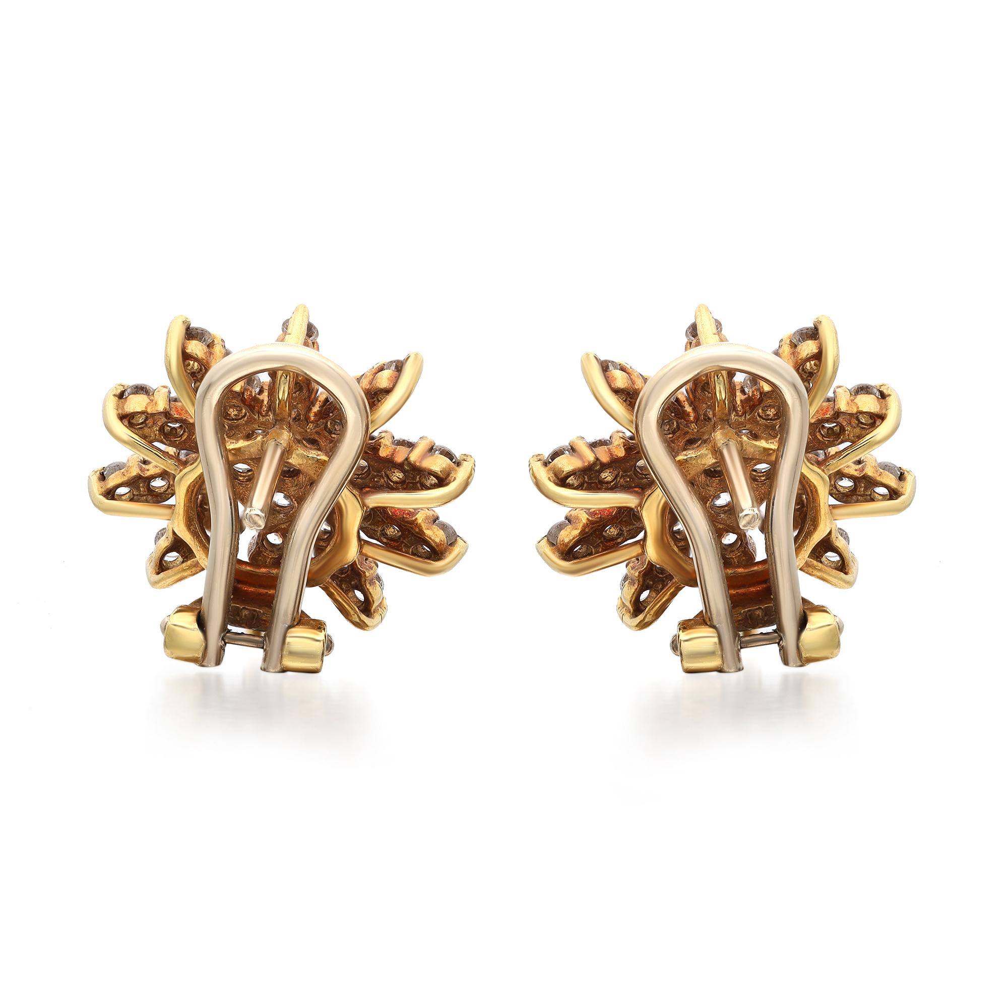 These fanciful floral earrings are reminiscent of springtime blooms. Featuring diamond stud earrings crafted in 18k yellow gold. These earrings are encrusted with prong set round brilliant cut diamonds weighing 1.85 carats. Diamond quality: color
