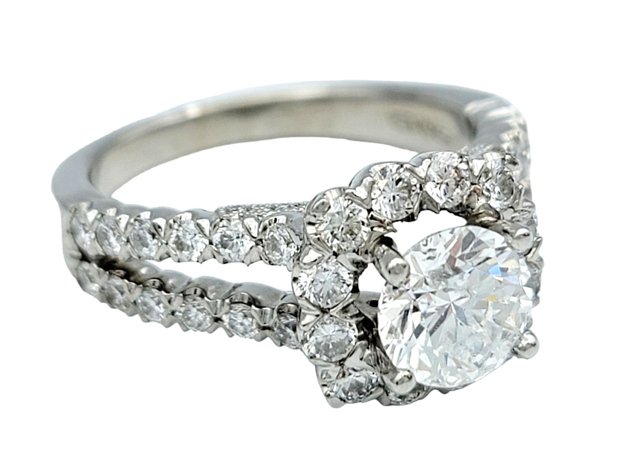 Contemporary Round Cut Diamond Halo and Split Shank Engagement Ring in 14 Karat White Gold For Sale