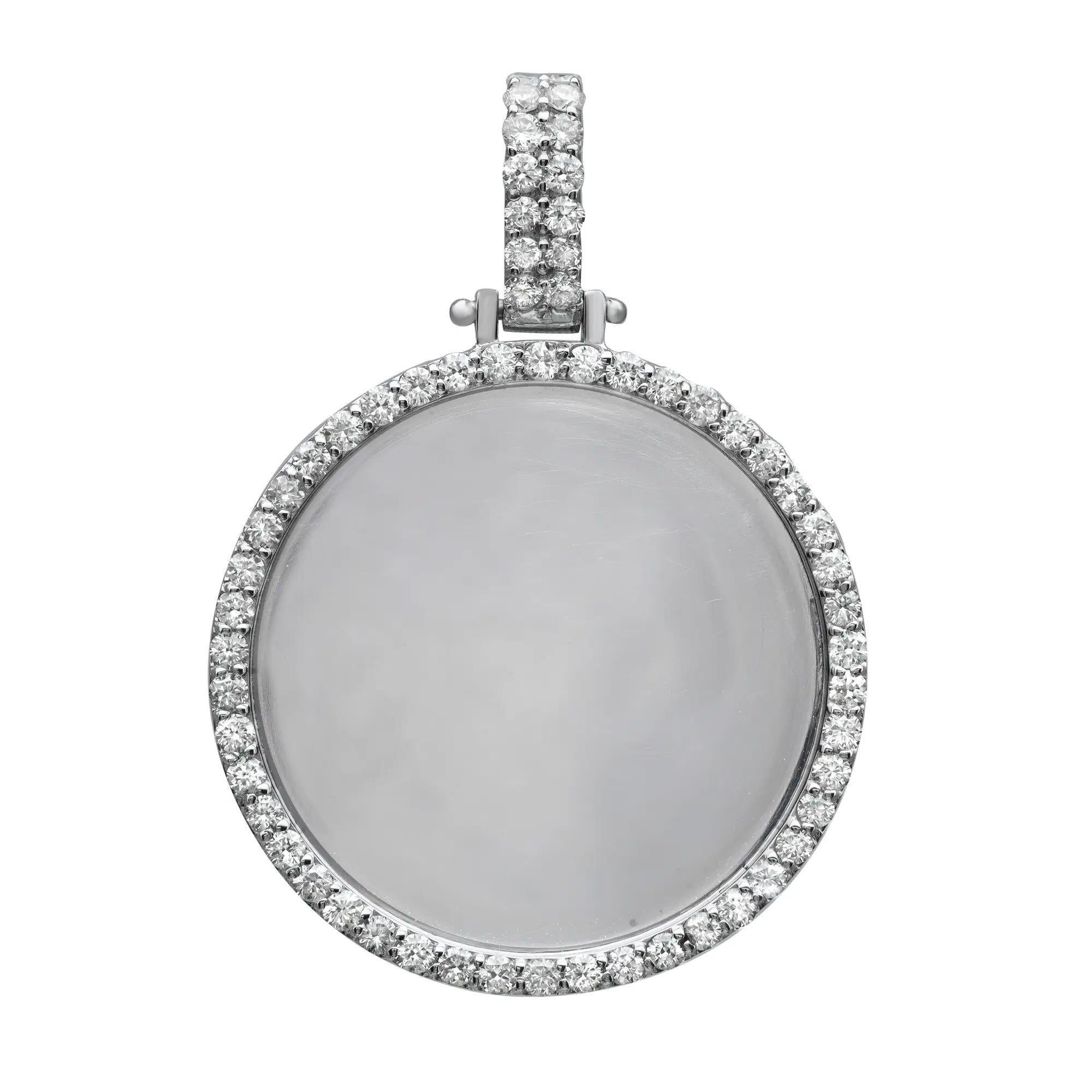 Simple and elegant, this beautiful photo pendant will make a perfect gift or addition to any jewelry collection. Crafted in 14K white gold, it features a round shape pendant with an outline of prong set round brilliant cut diamonds with the center