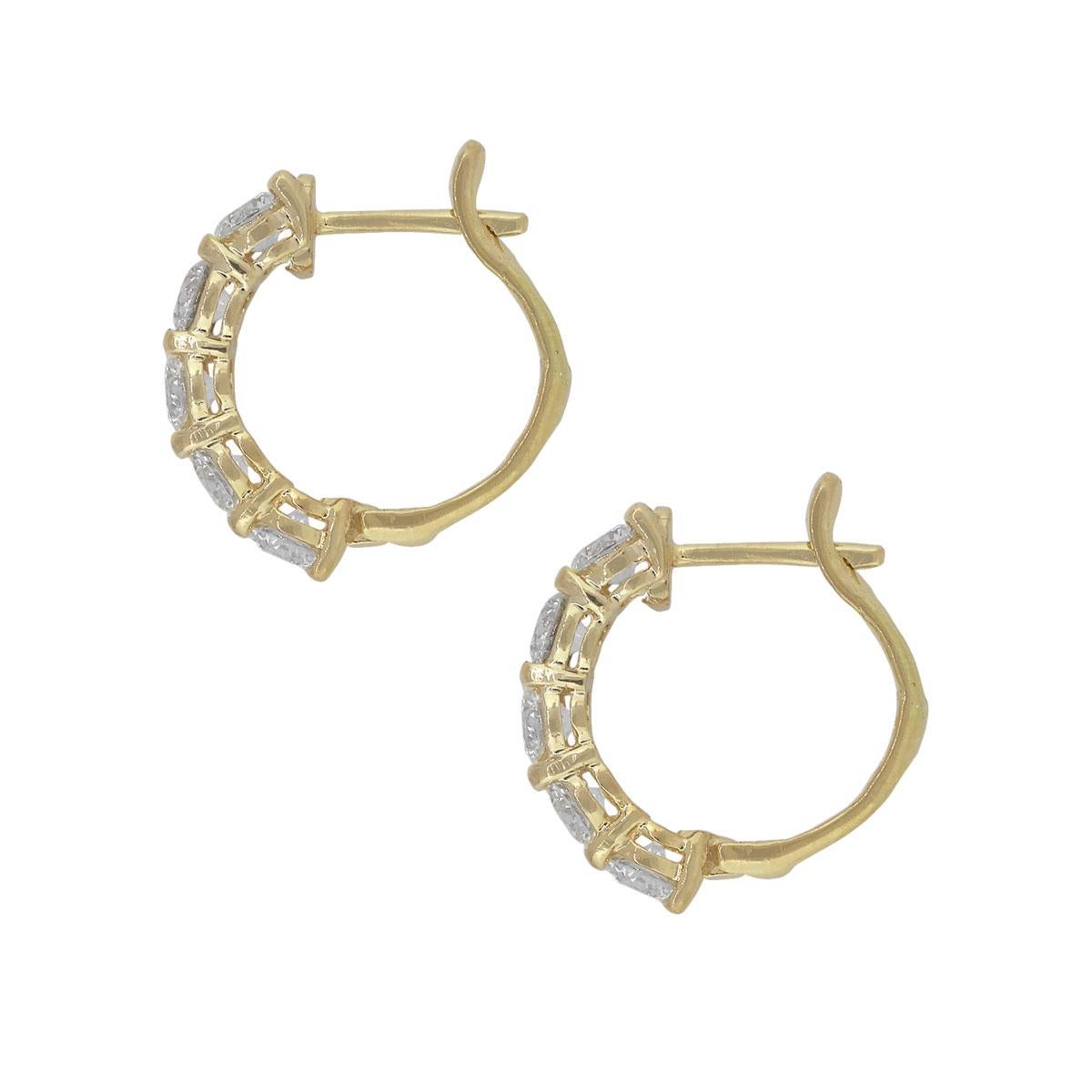 Material: 14k yellow gold
Diamond Details: Approx. 1.78ctw of round cut diamonds. Diamonds are G/H in color and VS in clarity
Earring Measurements: 0.62