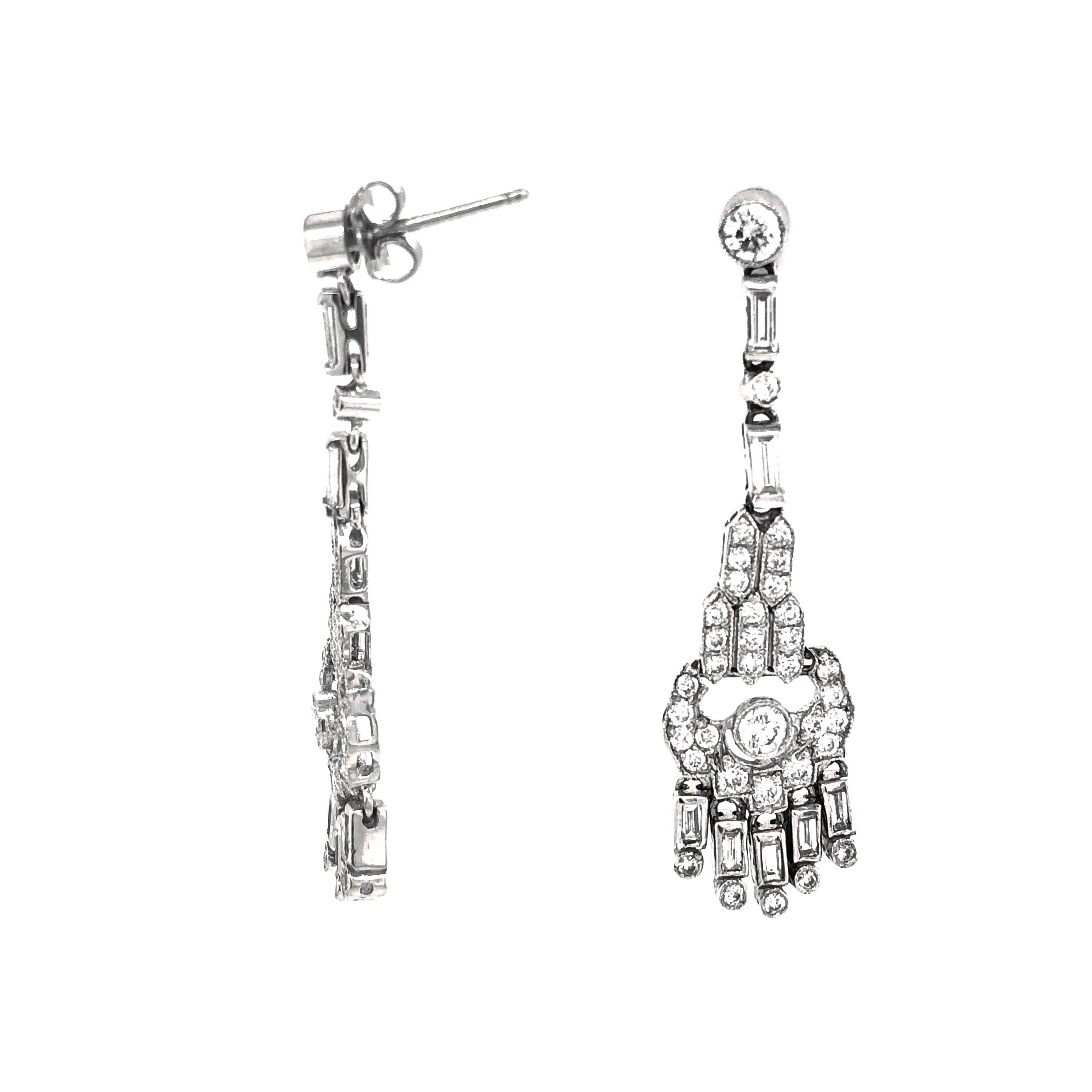 Beautiful classic design of pear shapes drop dangling platinum earrings adorned in white round diamonds 2.49 ct total.   
Diamonds are white and natural in G-H Color Clarity VS.
Platinum 950 metal.
Butterfly studs.
Simple and modern design makes