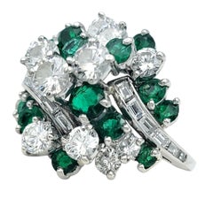 Round Cut Emerald and Diamond Domed Cluster Cocktail Ring in Polished Platinum