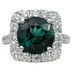 Round Cut Green Tourmaline and Squared Diamond Halo Ring in 18 Karat White Gold