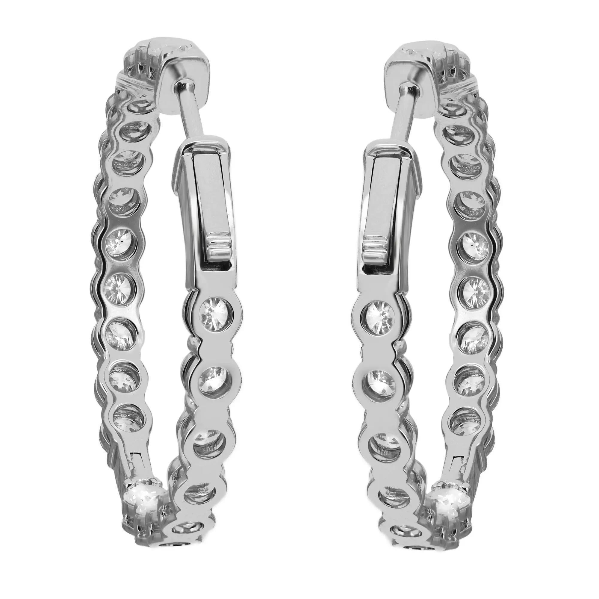 These stylish and elegant lab grown diamond inside out hoop earrings feature 40 prong-set round brilliant cut lab grown diamonds in a single line. The diamonds embellish these earrings on the inside and the outside, offering a dazzling look from