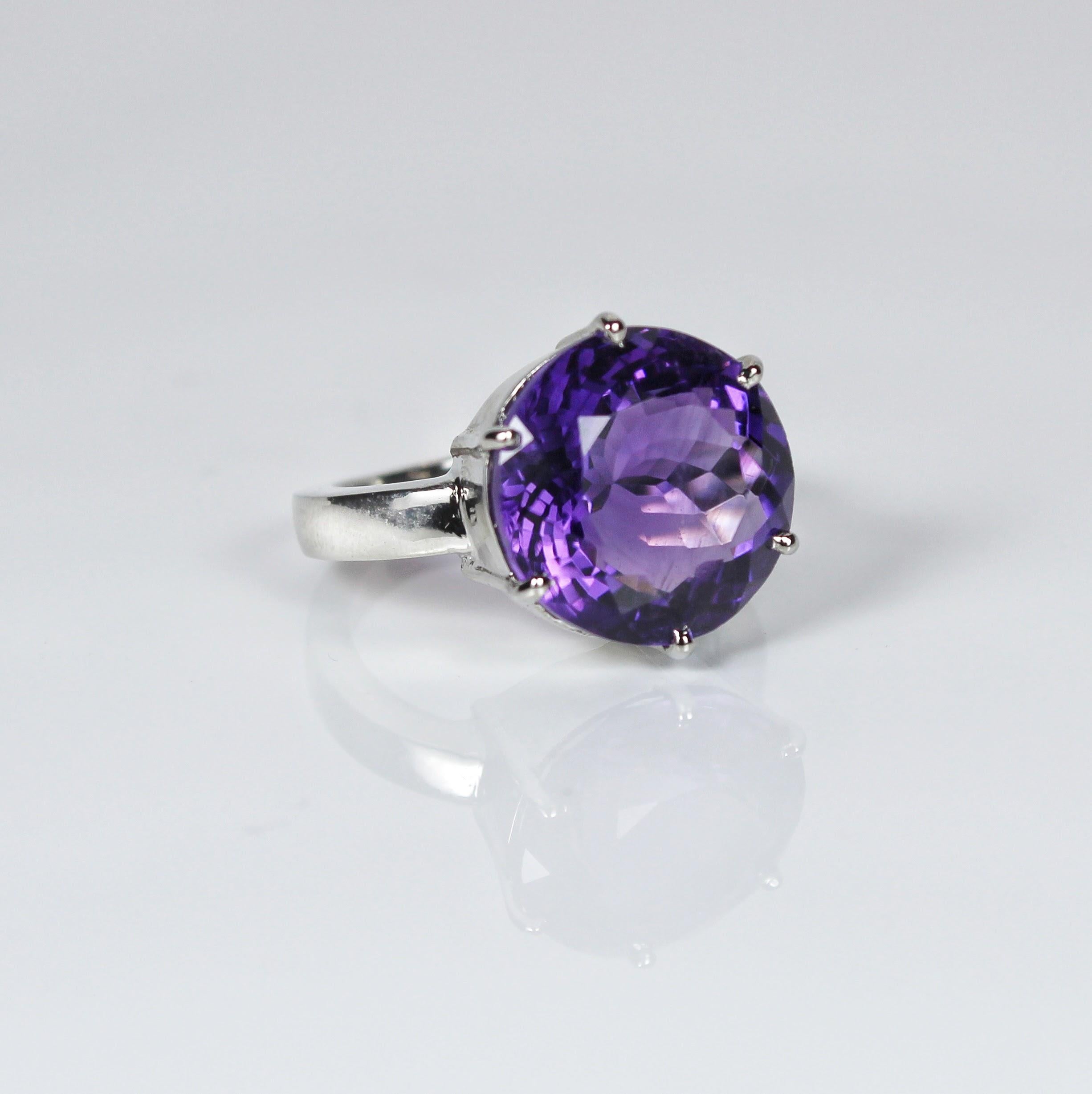 Product Details:

Metal - Silver
Indian ring size - 12
Product gross Weight - 4.350 Grams
Gemstone - Natural amethyst
Stone weight - 6.05 Carat
Stone shape - Round
Stone size - 13 x 13 mm

Beautifully crafted with silver and swarovski diamonds, this