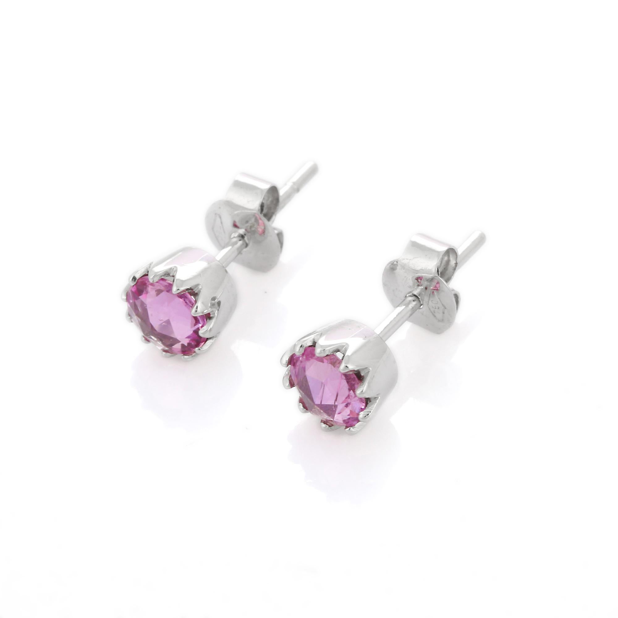 Studs create a subtle beauty while showcasing the colors of the natural precious gemstones and illuminating diamonds making a statement.

Round cut pink sapphire studs with diamonds in 18K gold. Embrace your look with these stunning pair of earrings