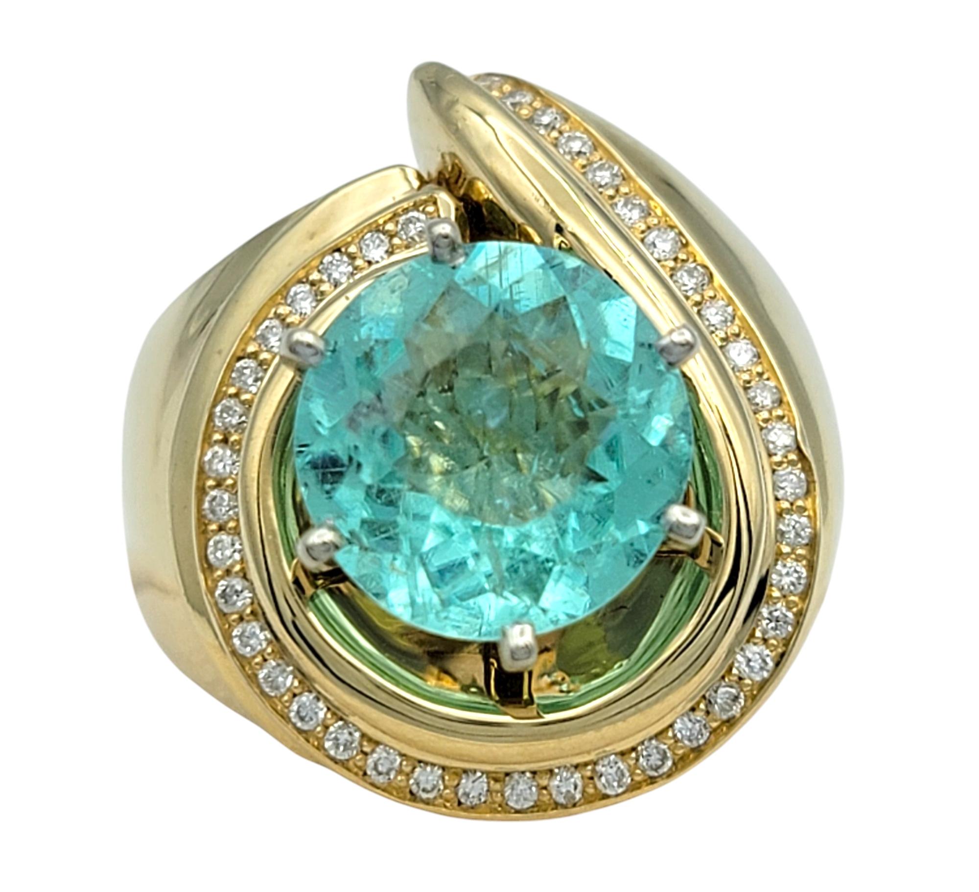 Ring Size: 7

This mesmerizing Paraiba tourmaline and diamond ring is a true work of art, radiating elegance and sophistication. At its center lies a rare bluish-green Paraiba tourmaline, sourced from Mozambique, with a captivating round modified