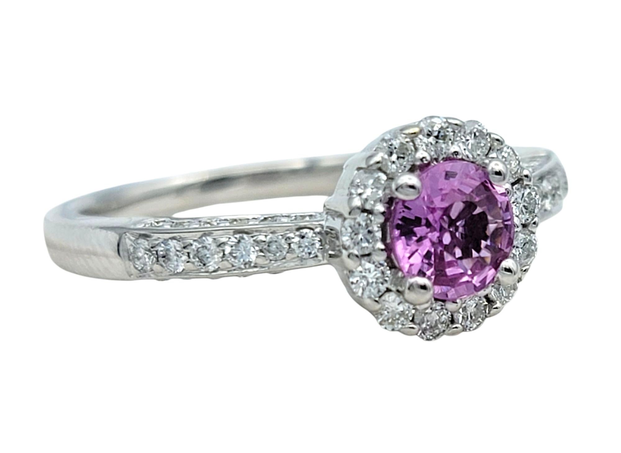Contemporary Round Cut Pink Sapphire and Pavé Diamond Halo Ring in 14 Karat White Gold For Sale
