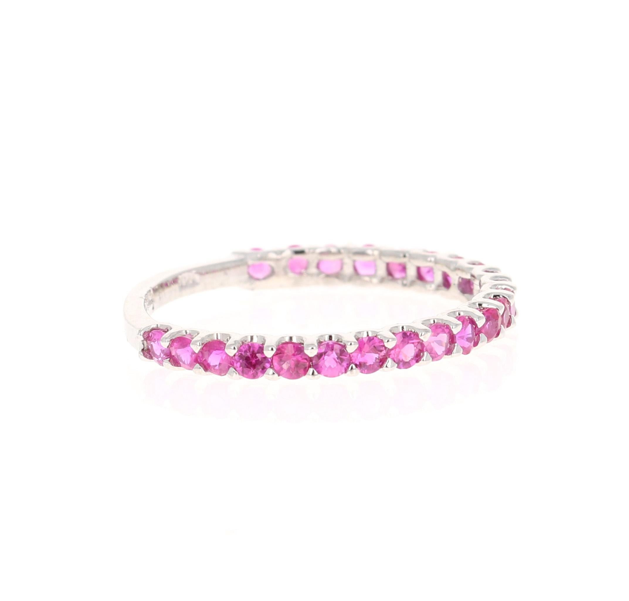 This ring has 23 Natural Round Cut Dark Pink Sapphires that weigh 0.87 Carats. 

Crafted in 14 Karat White Gold and weighs approximately 1.3 grams 

The ring is a size 7 and can be re-sized at no additional charge!

We have this same ring available