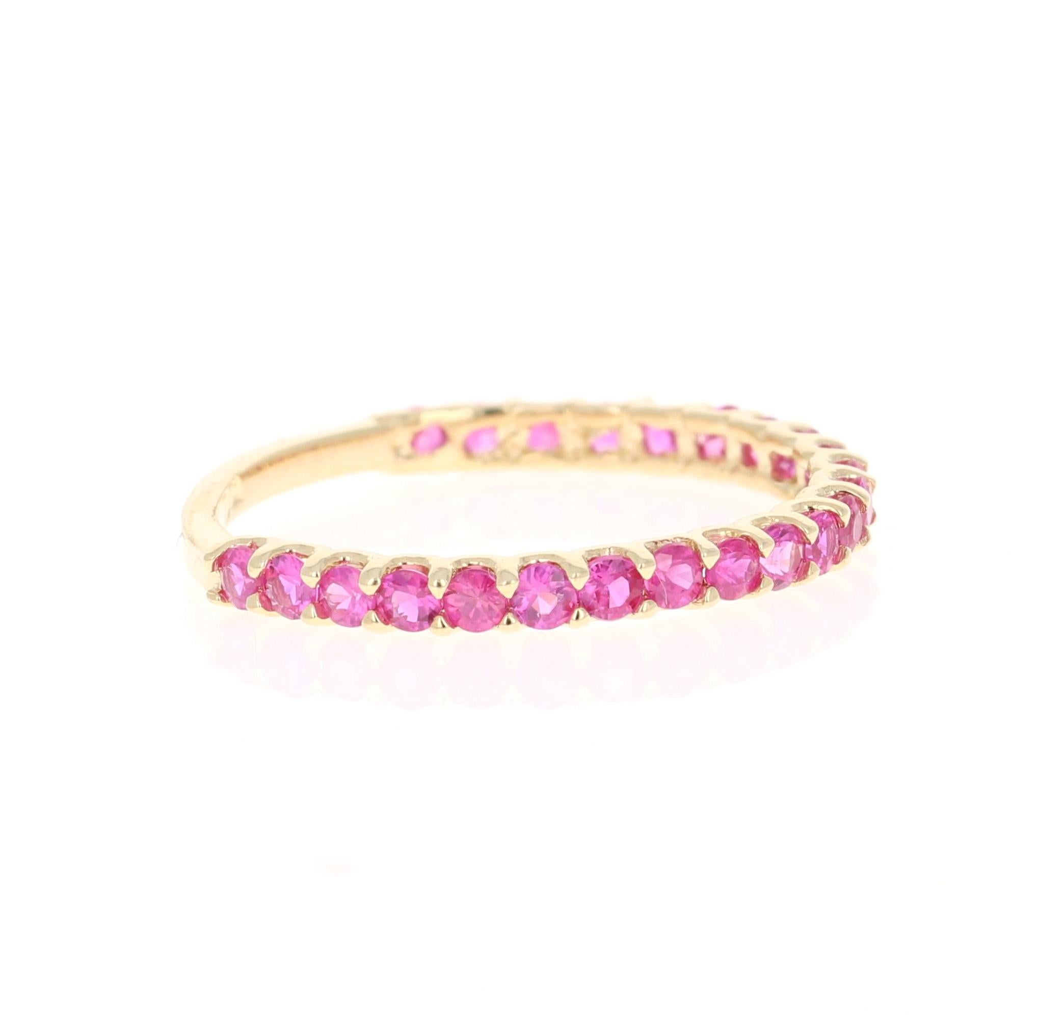 This ring has 23 Natural Round Cut Dark Pink Sapphires that weigh 0.87 Carats. 

Crafted in 14 Karat Yellow Gold and weighs approximately 1.3 grams 

The ring is a size 7 and can be re-sized at no additional charge!

We have the same band in white