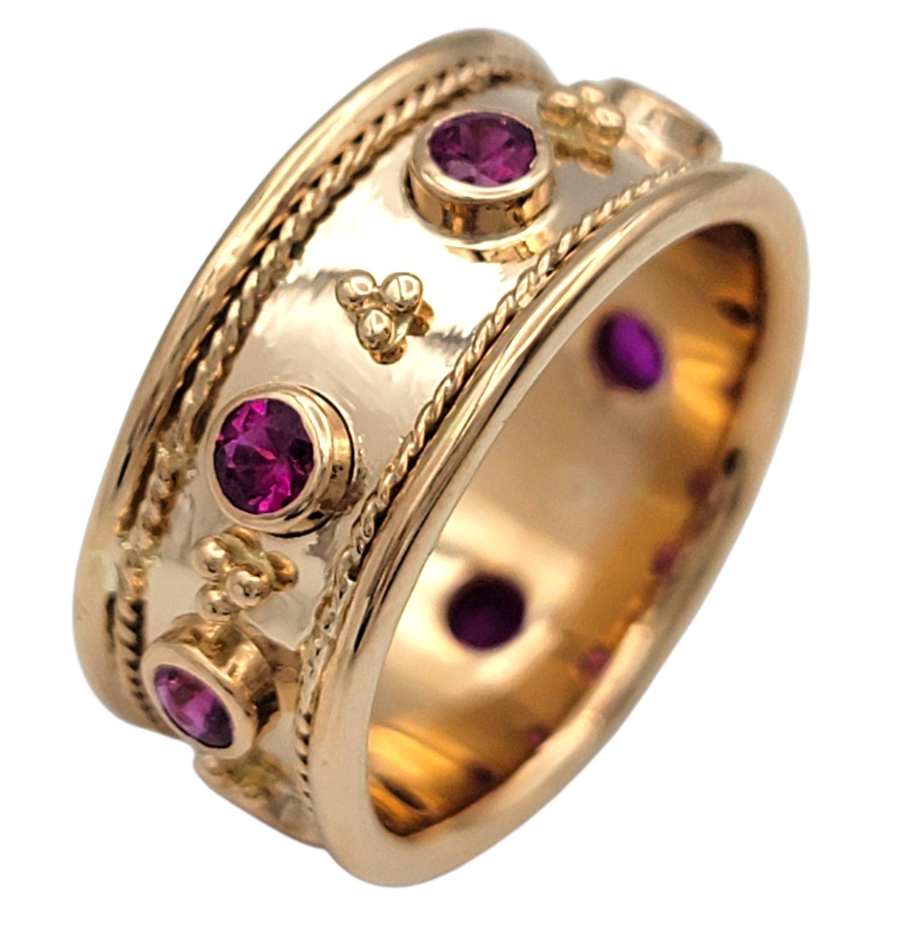 Ring Size: 4

Designed with a playful spirit and regal charm, this pink sapphire ring showcases a series of round brilliant cut pink sapphires set into a wide band of richly polished 18 karat rose gold. The sapphires are each set in recessed round