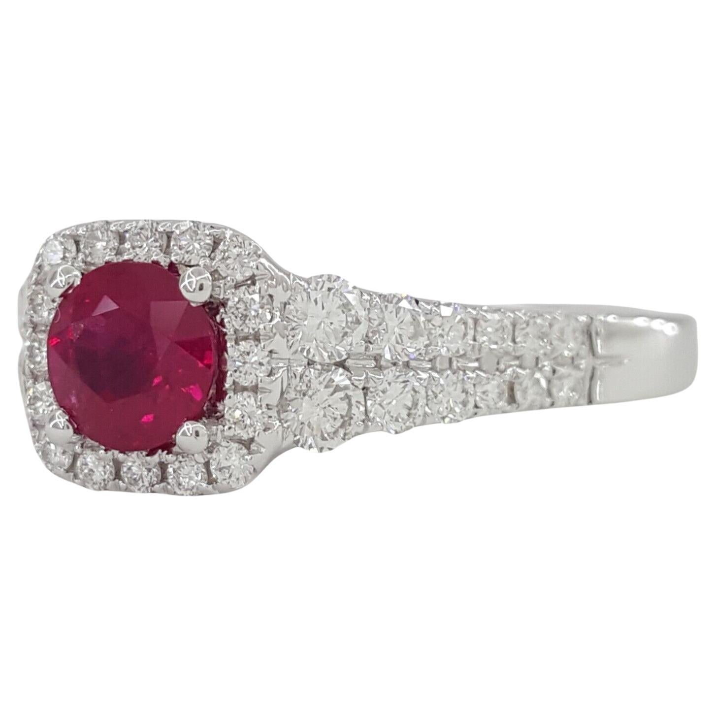 Round Cut Ruby & Round Brilliant Cut Diamond Halo Engagement Ring 14kk White Gold.  
The ring weighs 4.5 grams, size 7, the center is a Natural Round Cut Natural Red Burma Ruby weighing ~0.55 ct.
There are 40 Natural Round Brilliant Cut Diamonds