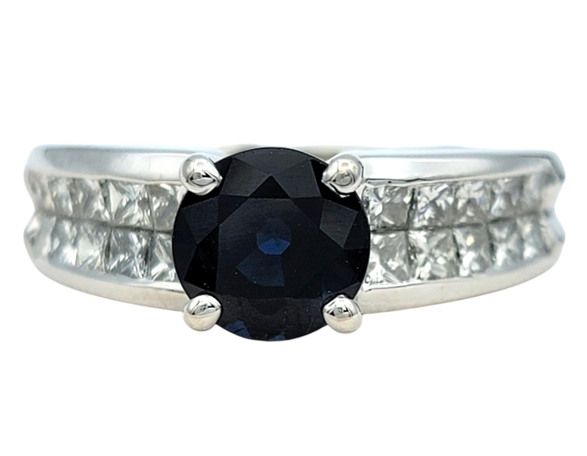 Ring Size: 7 

Discover the perfect union of timeless design and luxurious craftsmanship with this exquisite ring. At its heart lies a mesmerizing round sapphire, its deep, enchanting blue hue evoking a sense of regal sophistication. This striking