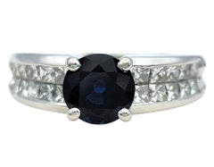 Round Cut Sapphire and Princess Cut Diamond Band Ring in 18 Karat White Gold