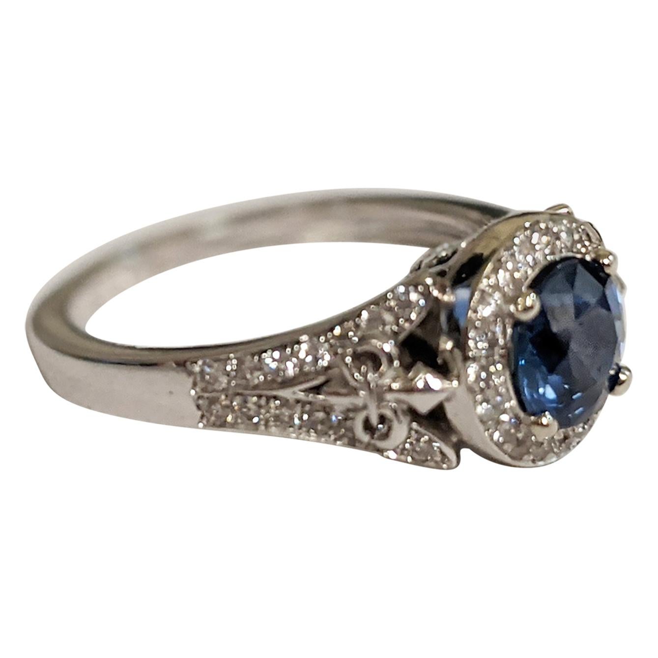 Round-Cut Sapphire Ring with Diamond Halo and Details